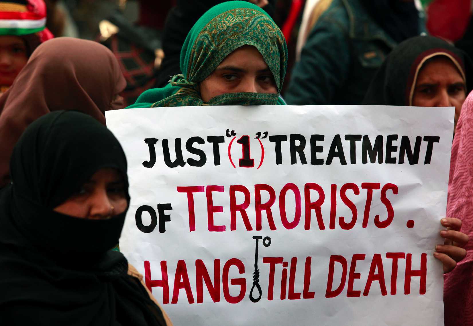Demonstrators in the Pakistani city of Lahore on Dec. 21, 2014, condemn the attack by Taliban gunmen on the Army Public School in Peshawar (Mohsin Raza—Reuters)