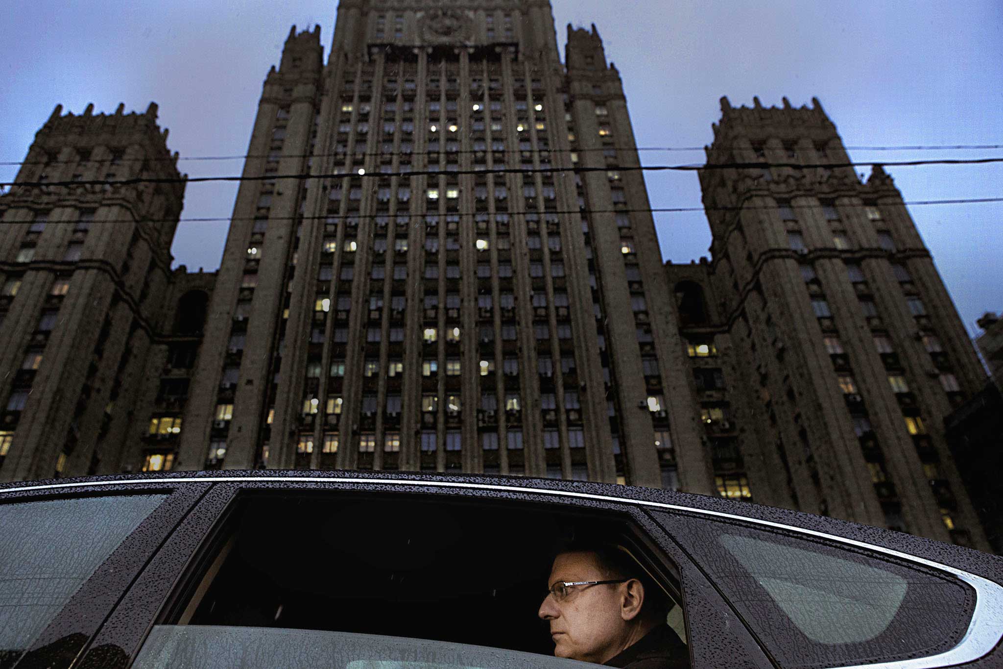 Outside the Foreign Ministry building in Moscow, Konstantin Dolgov is seated in his car. Dolgov is the Russian diplomat charged with defending ethnic Russians beyond the country’s border, with a particular focus on the Baltics, Oct. 17, 2014.