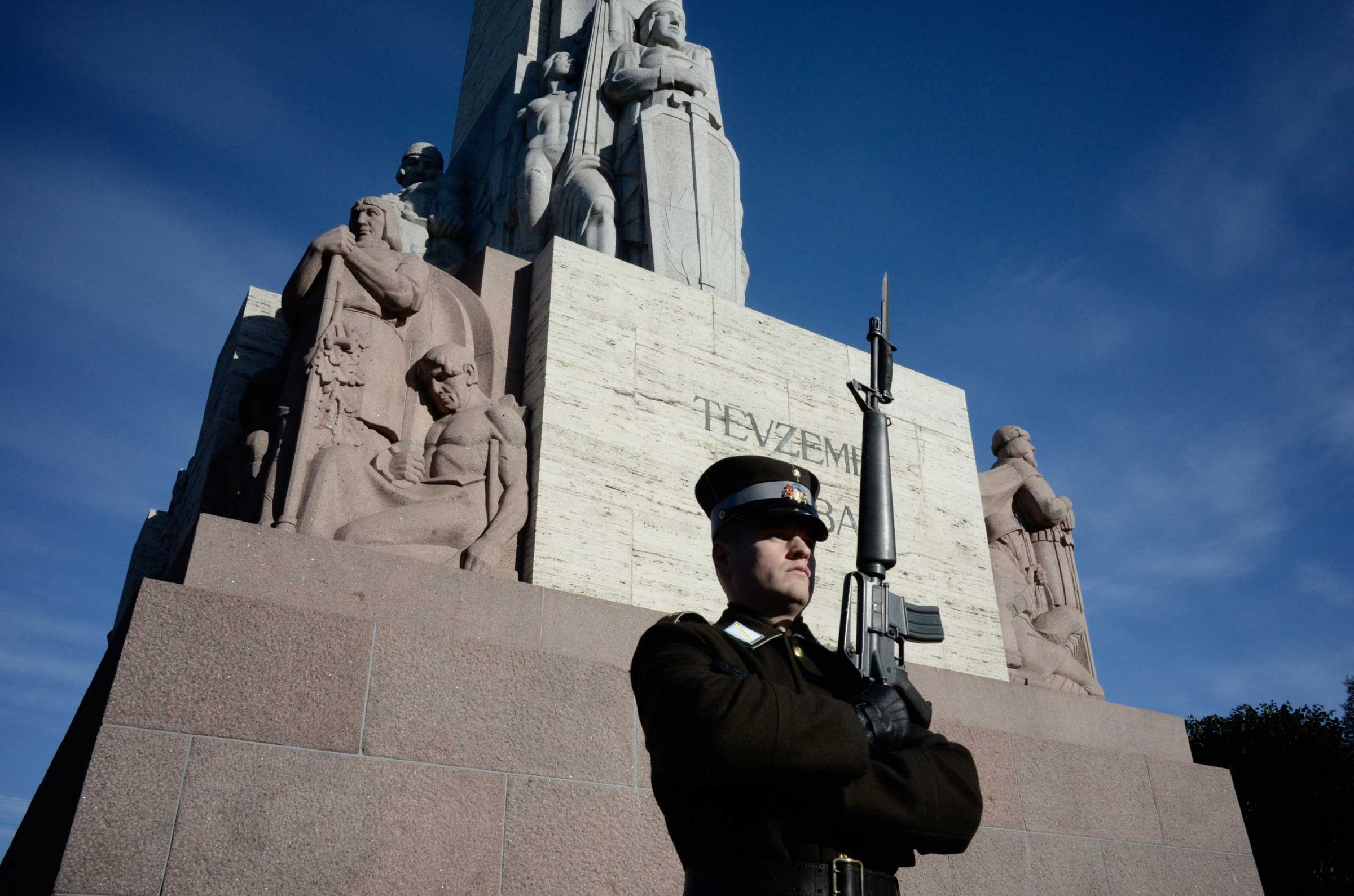 A guard stands at the Freedom monument in Riga, Latvia, a memorial to the soldiers killed during the Latvian war for independence. For many Latvians, it is a symbol of Latvia’ sovereignty and independence.