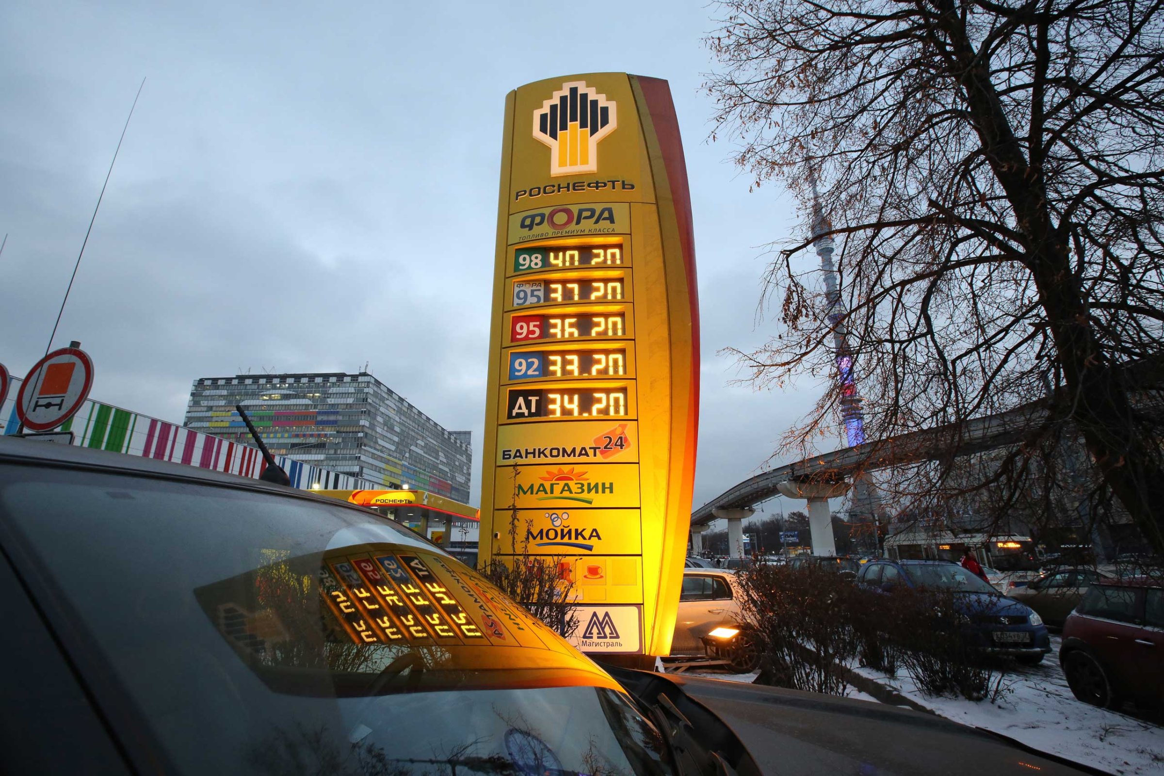 Ruble fuel prices sit on an illuminated electronic display board outside an OAO Rosneft gas station in Moscow, Dec. 2, 2014.