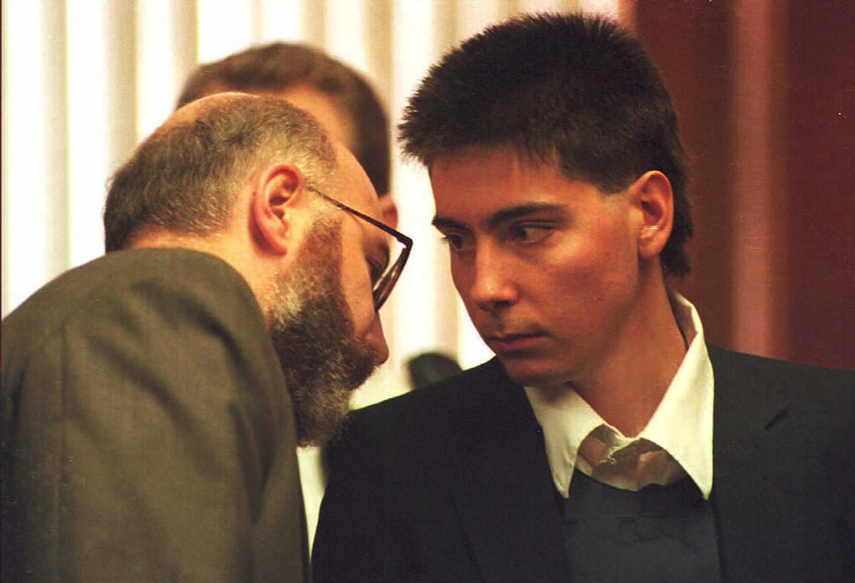 John C. Salvi, 3rd (R) speaks with his lawyer J. W. Carney during the Brookline District Court hearing where Salvi pleaded innocent to murder charges, in Brookline, Mass. (AFP/Getty Images)