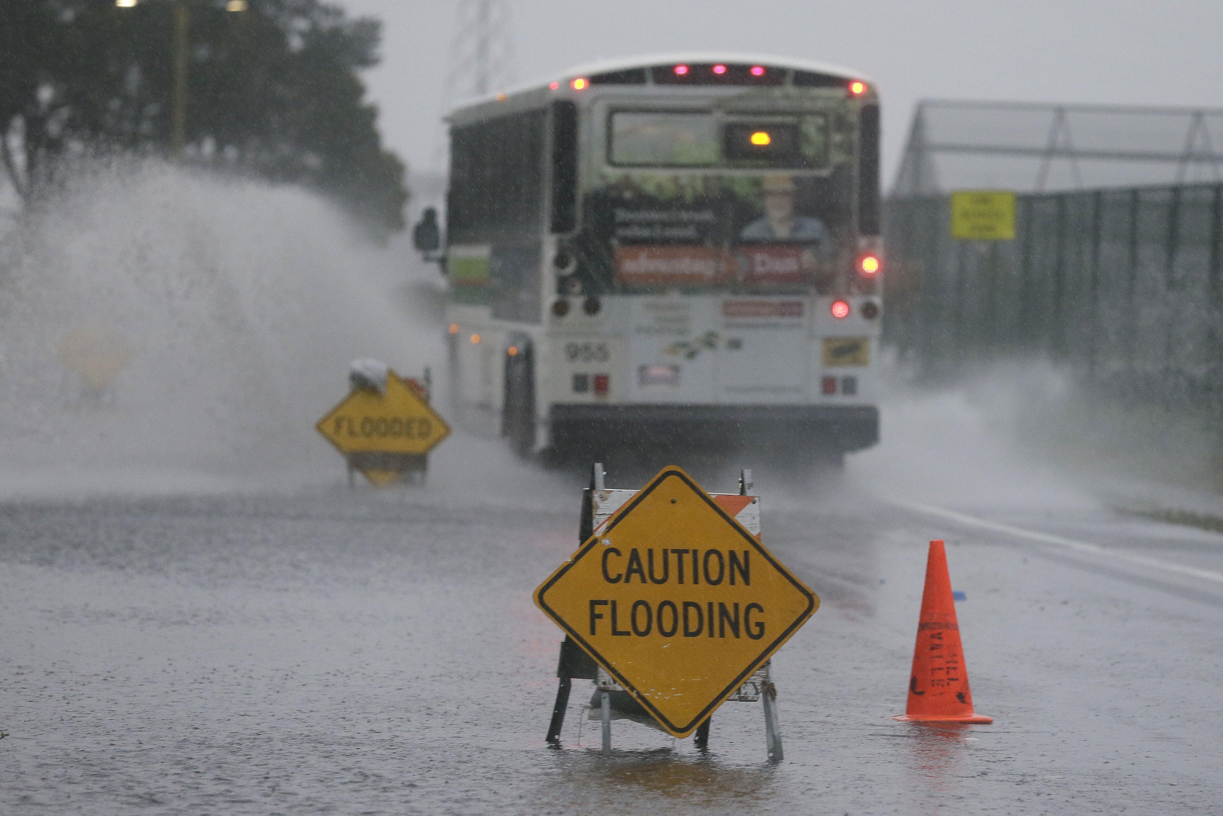 A bus passes through a flooded roadway on Dec. 11, 2014, in Mill Valley, Calif. (Eric Risberg—AP)