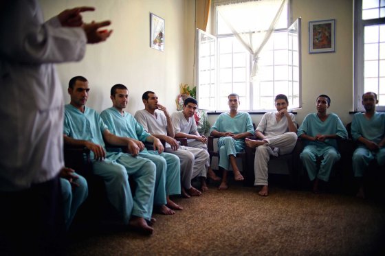 Recovering addicts attend a group counselling session at the government run Jangalak rehabilitation centre in Kabul.