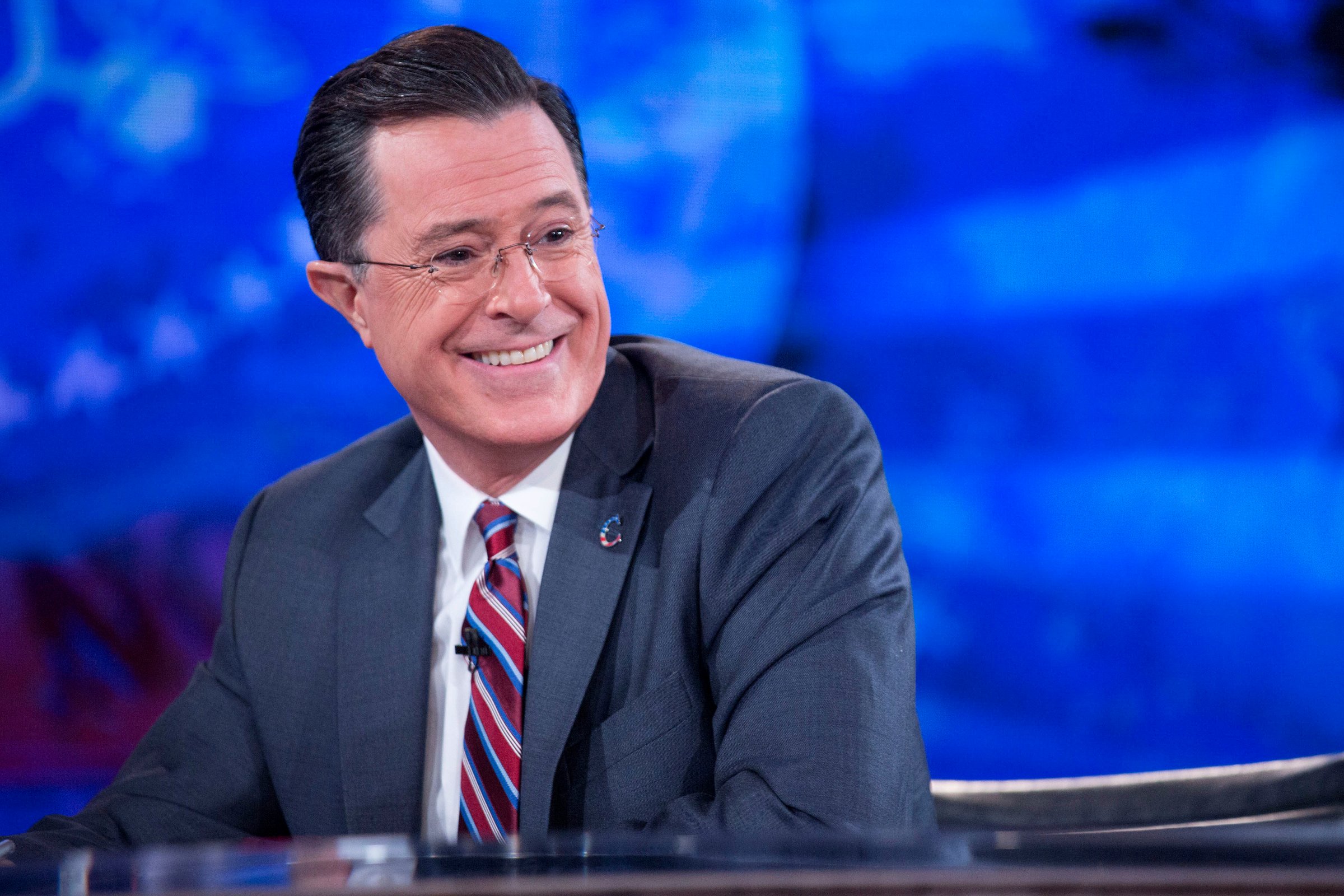 Television personality Stephen Colbert smiles while taping the "The Colbert Report" on Dec. 8, 2014.