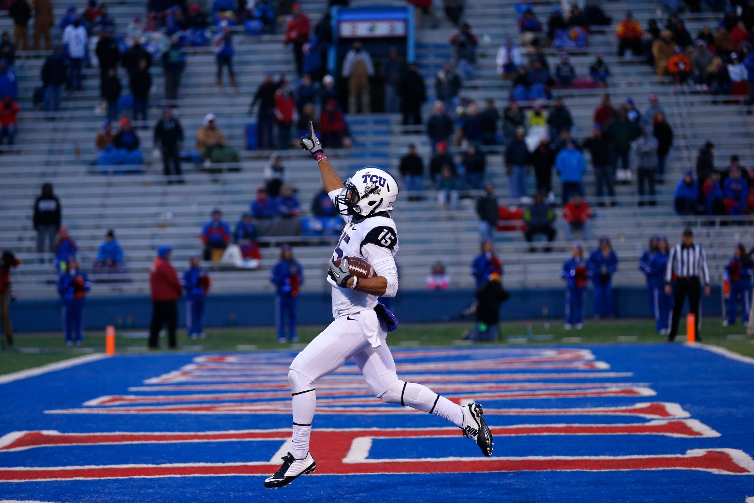 Cameron Echols-Luper of the TCU Horned Frogs celebrates his 69-yard punt return for a touchdown in the third quarter during a game against the Kansas Jayhawks at Memorial Stadium on Nov. 15, 2014 in Lawrence, Kansas.