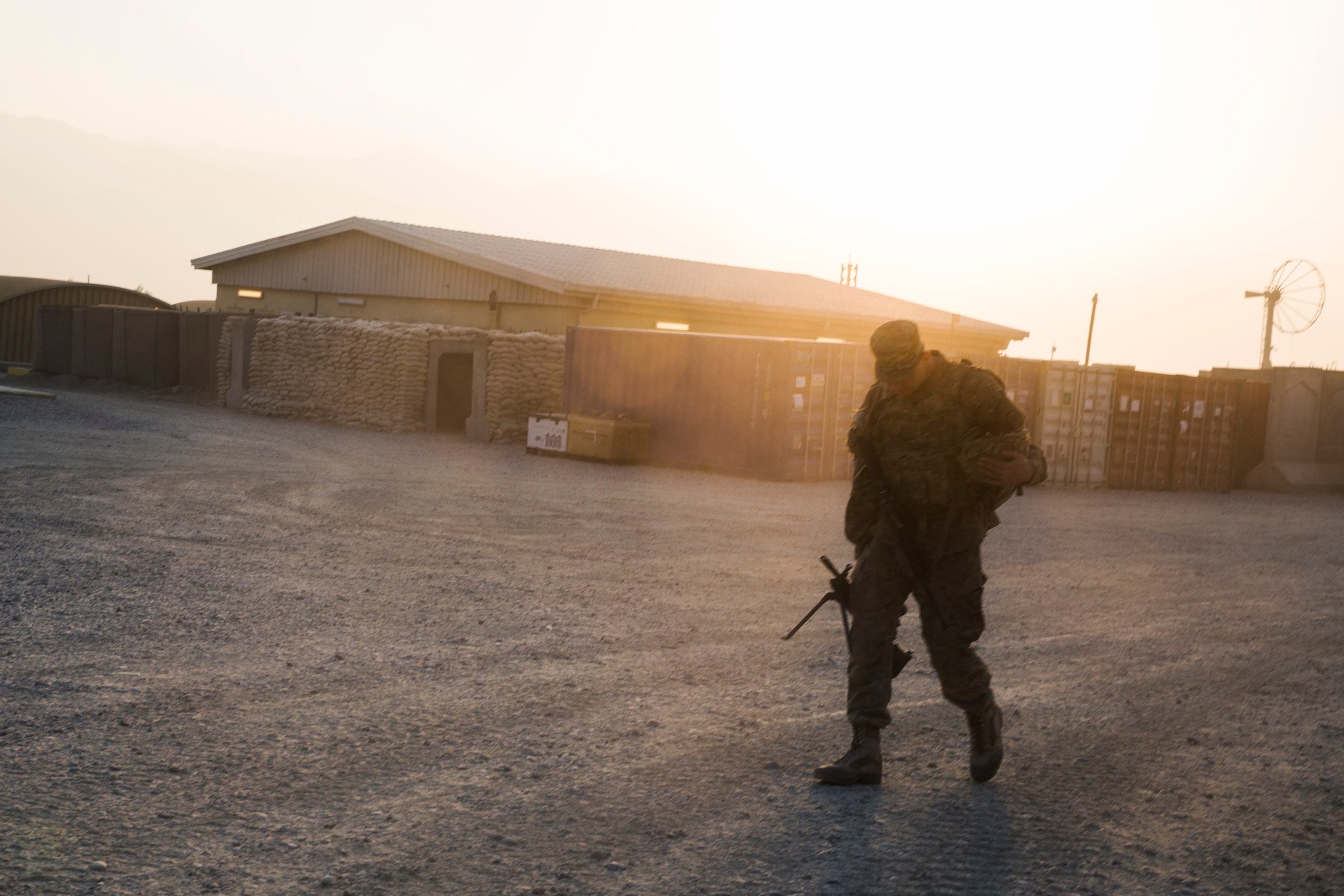 A U.S. soldier from the 3rd Cavalry Regiment walks with his rifle, after returning from a mission at forward operating base Gamberi, in the Laghman province of Afghanistan