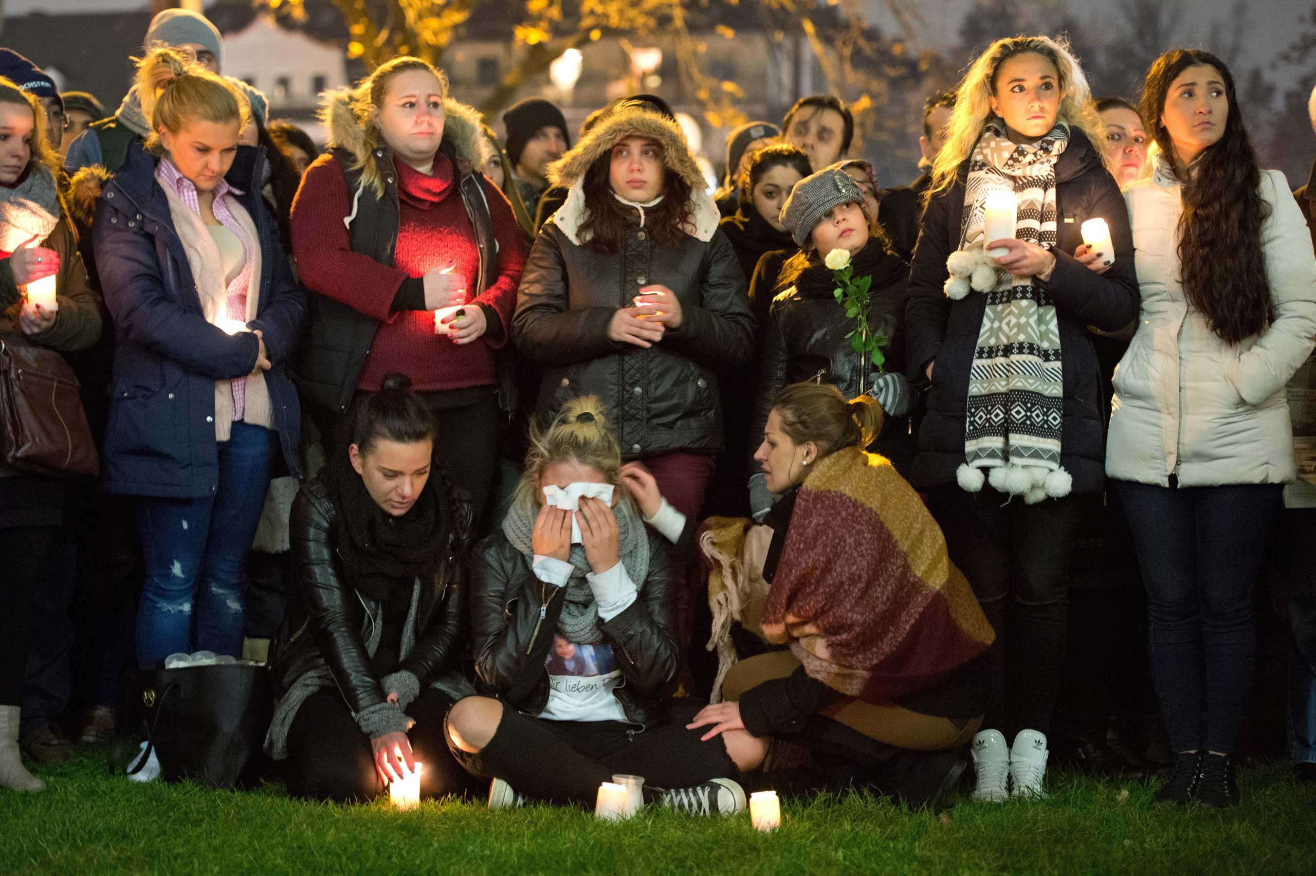 Vigil outside the hospital that treated Tugce Albayrak in Offenbach am Mein, Germany, Nov. 28, 2014. (Boris Roessler—EPA)