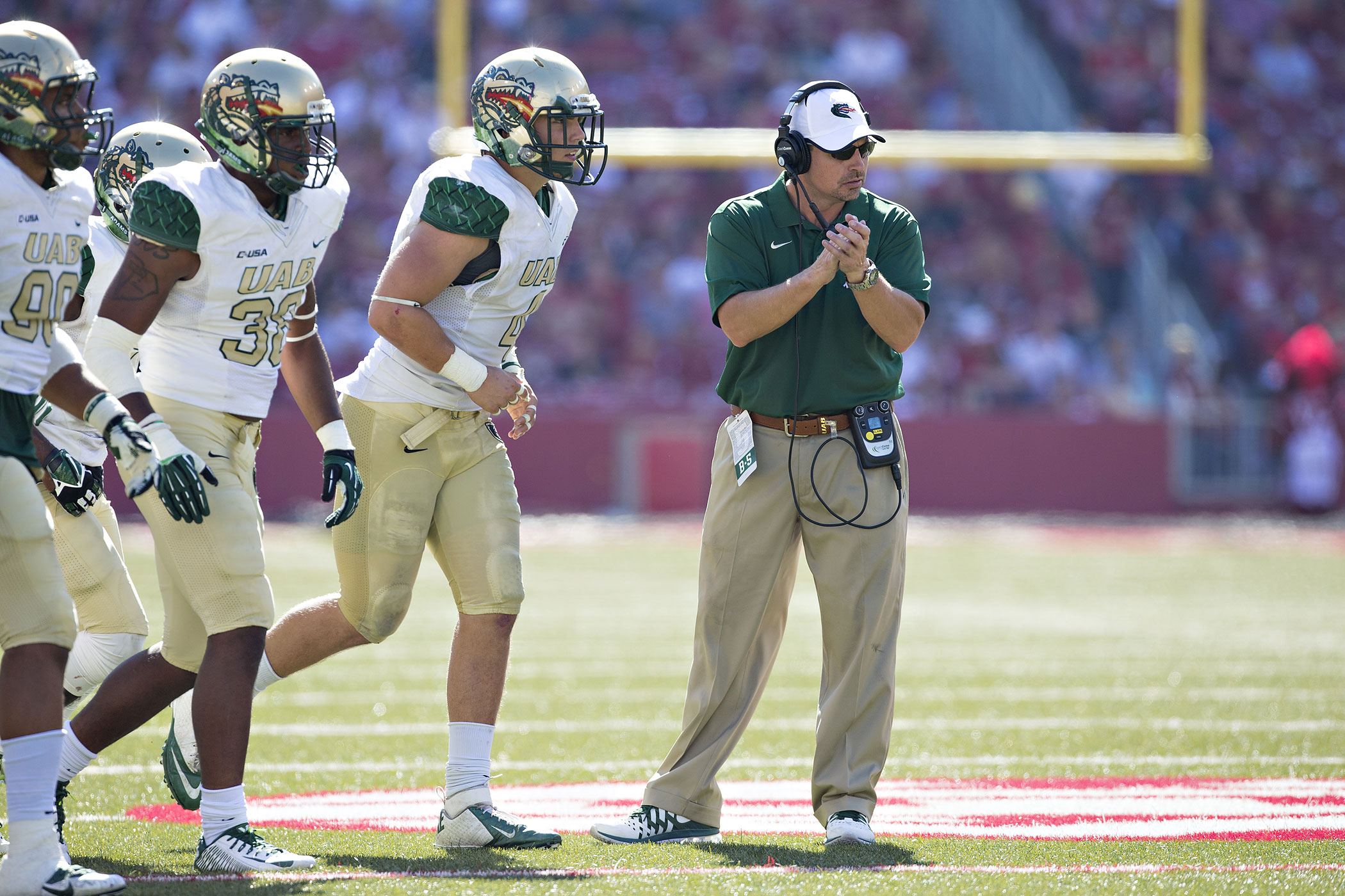 Head Coach Bill Clark of the University of Alabama at Birmingham Blazers is seen with his team during a game against the Arkansas Razorbacks at Razorback Stadium on October 25, 2014 in Fayetteville, Arkansas. (Wesley Hitt—Getty Images)