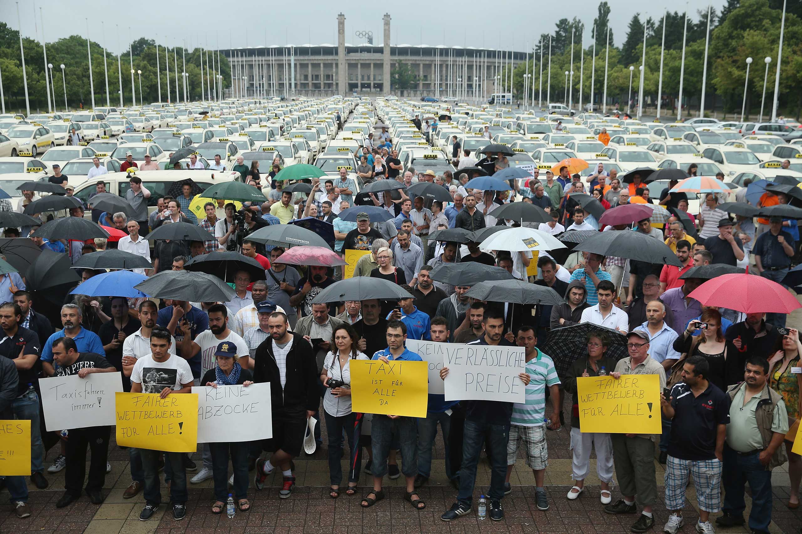 Hundreds of taxi drivers gather next to the Olympia Stadium to protest ride-sharing apps on June 11, 2014 in Berlin.