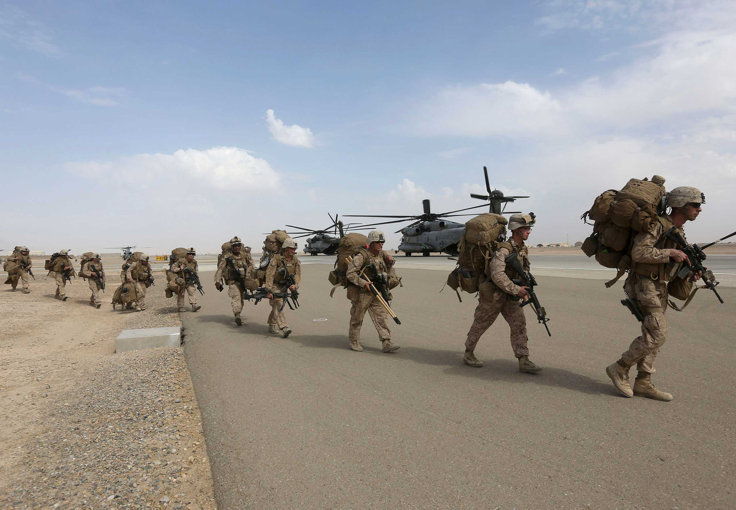 U.S. Marines prepare to depart upon the end of operations for Marines and British combat troops in Helmand