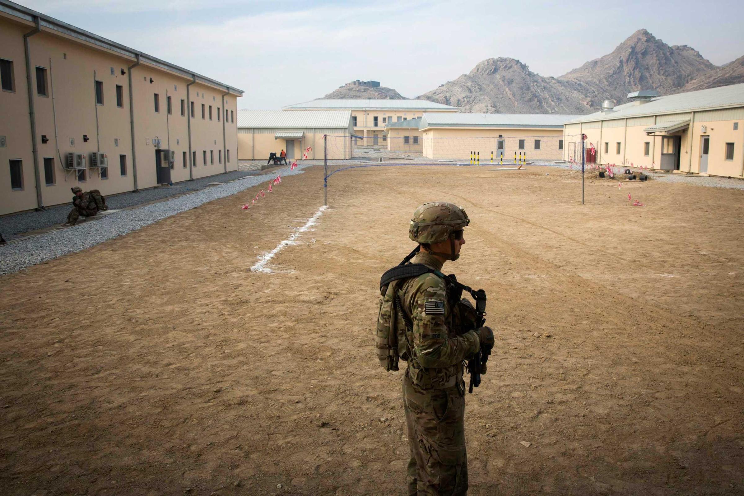 A U.S. soldier from the 3rd Cavalry Regiment walks through an Afghan police station constructed by ISAF near Jalalabad