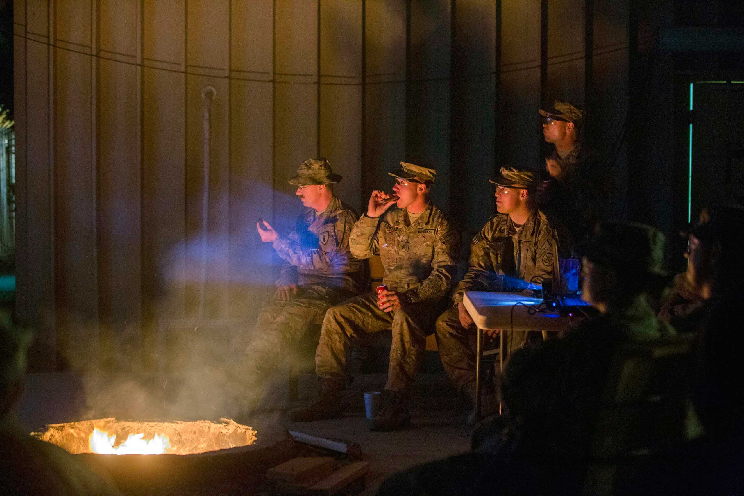 U.S. soldiers from the 3rd Cavalry Regiment watch  Die Hard  projected onto an outdoor wall as part of Christmas Day celebrations on forward operating base Gamberi in the Laghman province of Afghanistan on Dec. 25, 2014.