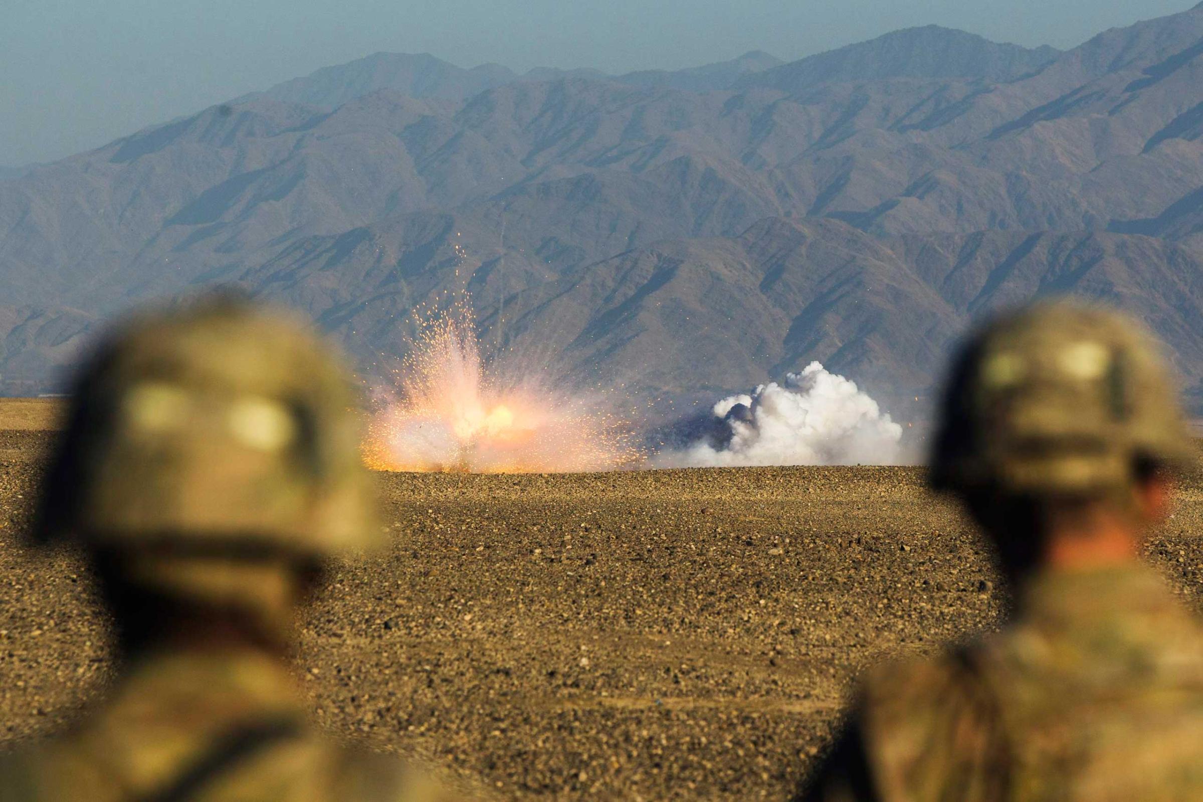 U.S. soldiers in Dragon Company of the 3rd Cavalry Regiment watch rounds explode downrange during a mortar exercise near forward operating base Gamberi in the Laghman province of Afghanistan