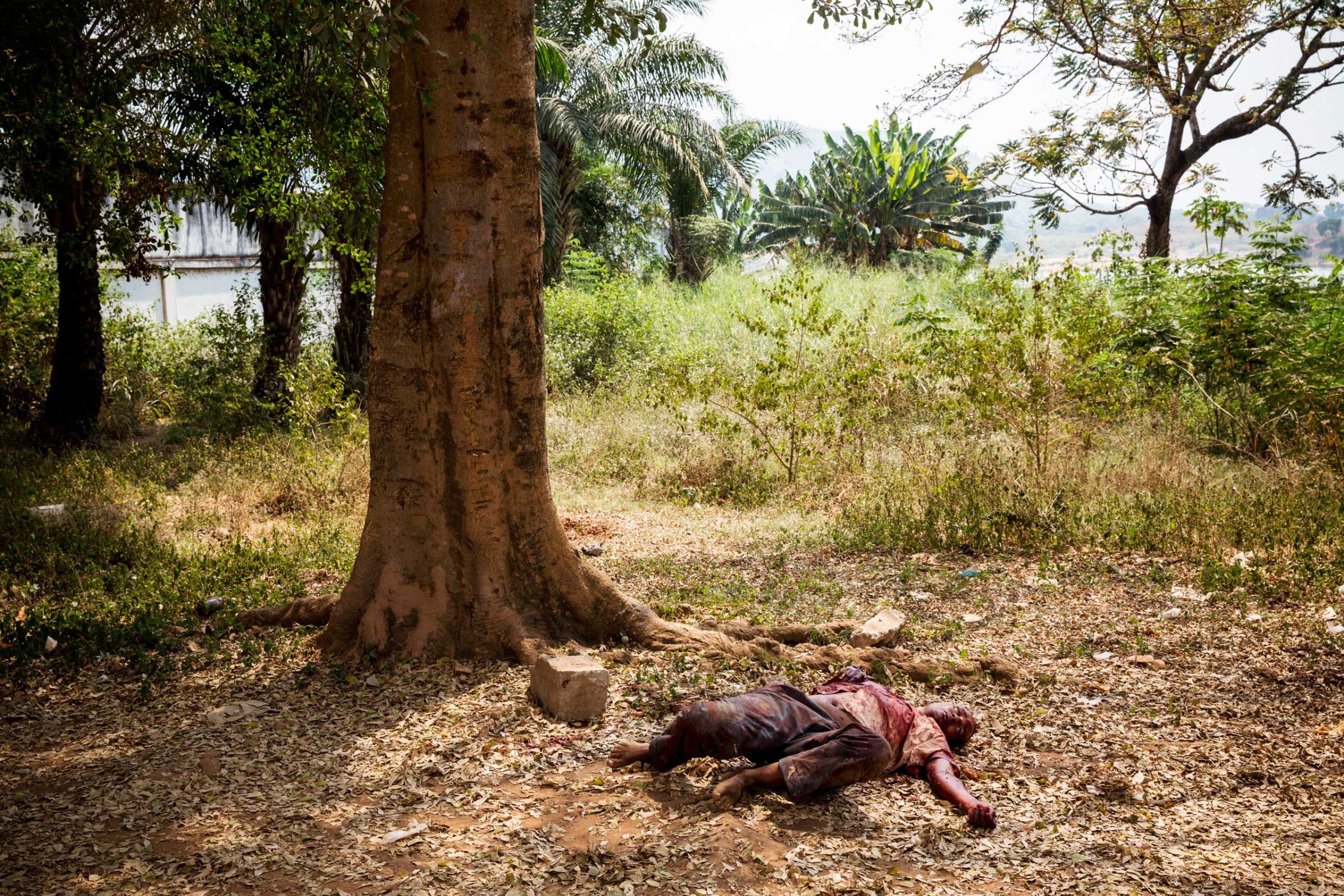 BanguiA wounded muslim man lay on the ground after being attacked by dozen of angry christians saying he is a Seleka member. He is protected by MISCA and french soldiers but he will died from his wounds before a medic arrived.