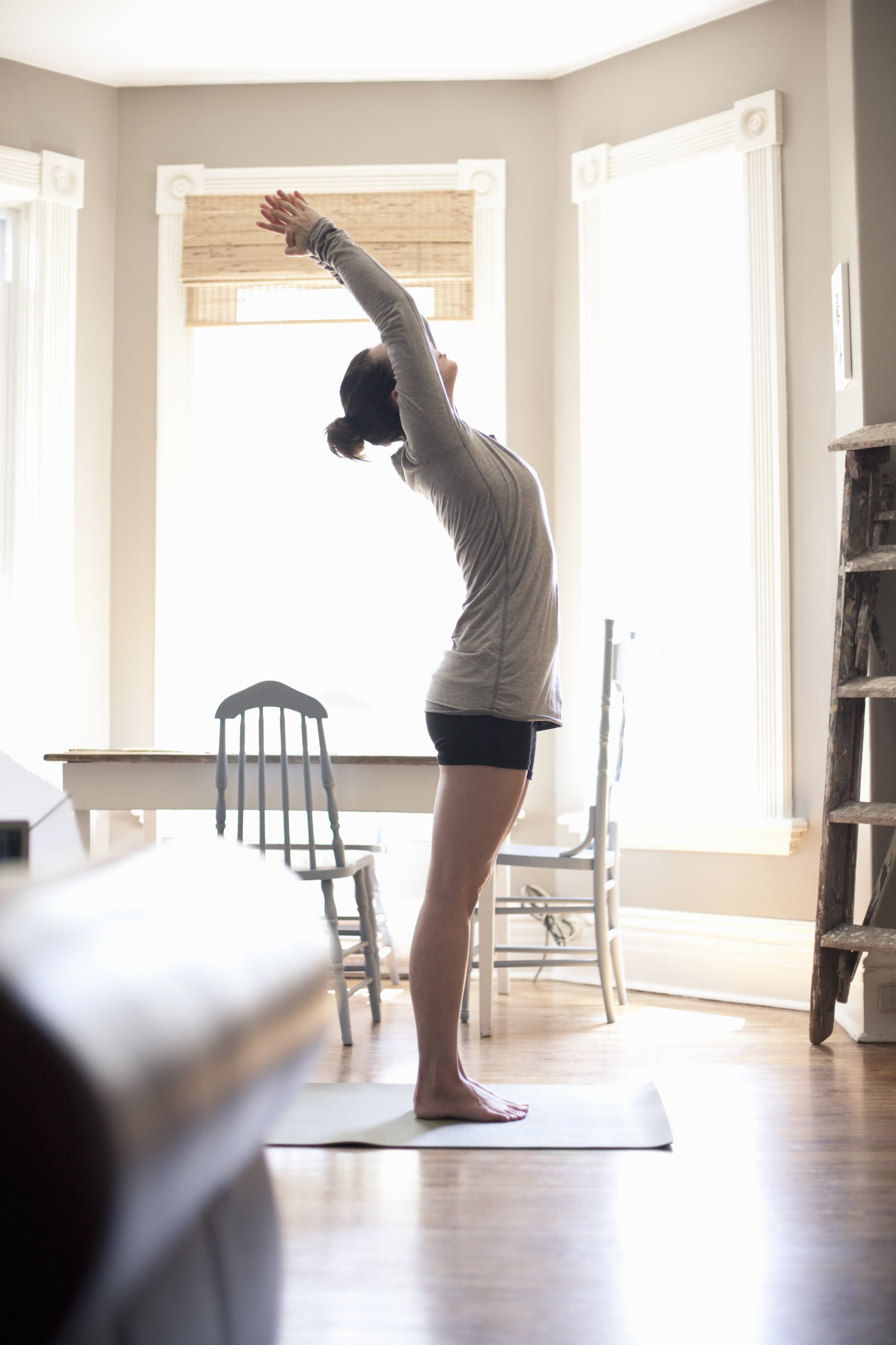 woman-stretching-home