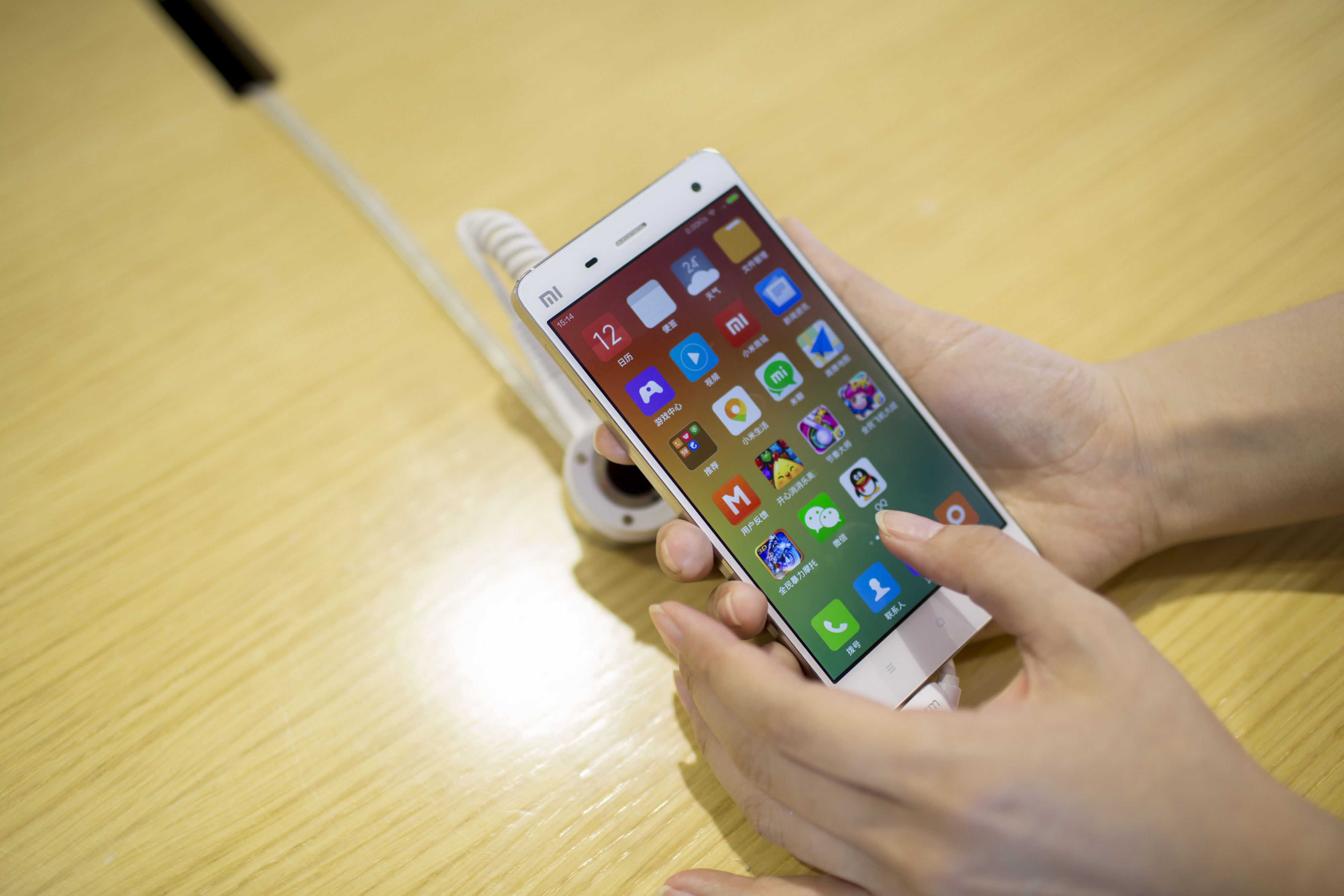 A Xiaomi Corp. Mi 4 smartphone is arranged for a photograph at the company's showroom in Beijing, China, on Sept. 12, 2014. (Bloomberg via Getty Images)