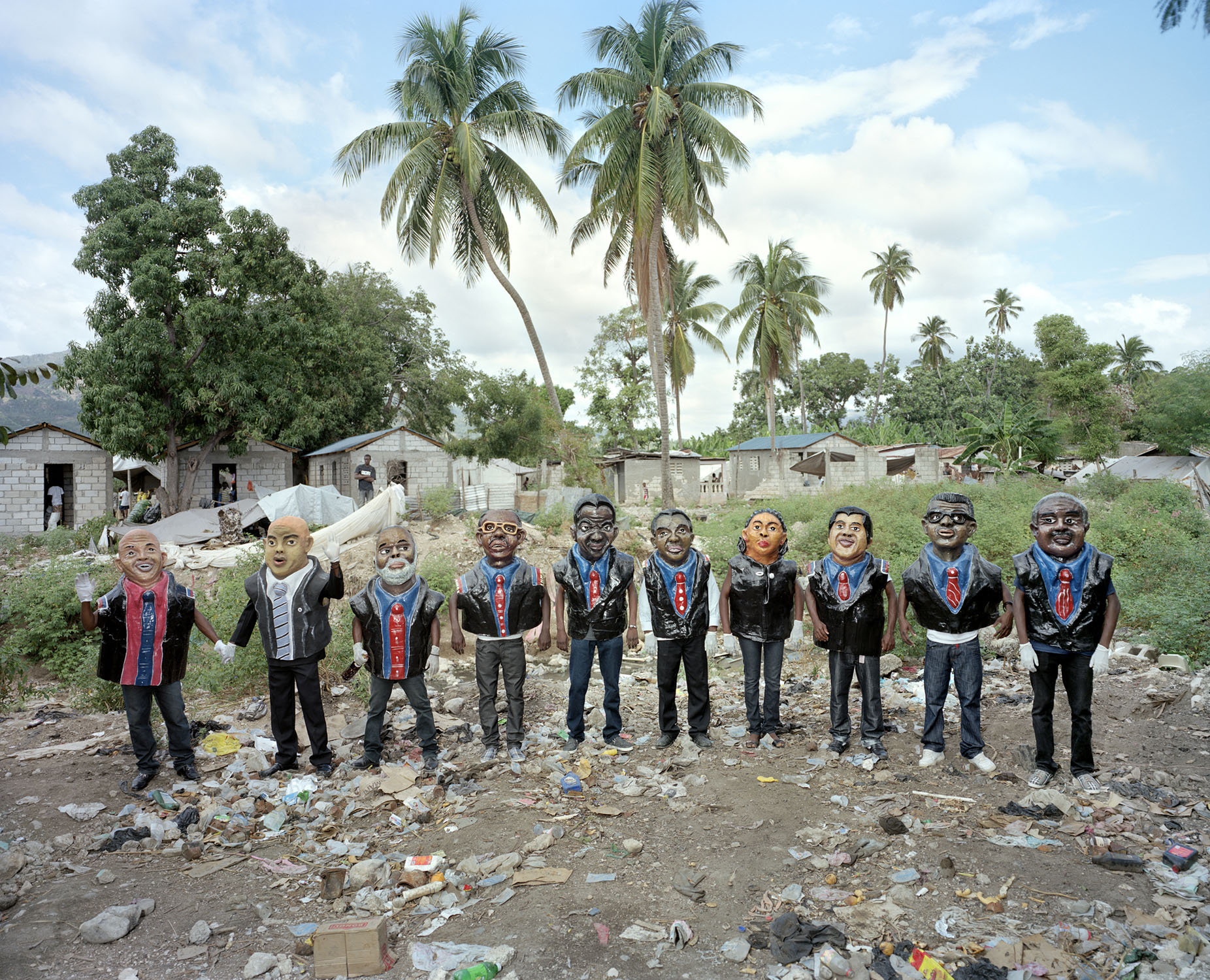 Papier-mch masks representing the last nine Haitian presidents, in chronological order from right to left, at the Jacmel carnival. Current president Michel Martelly, to the far left, holds the hand of his prime minister, Laurent Lamothe. Jacmel.Paolo WoodsÑINSTITUTE
