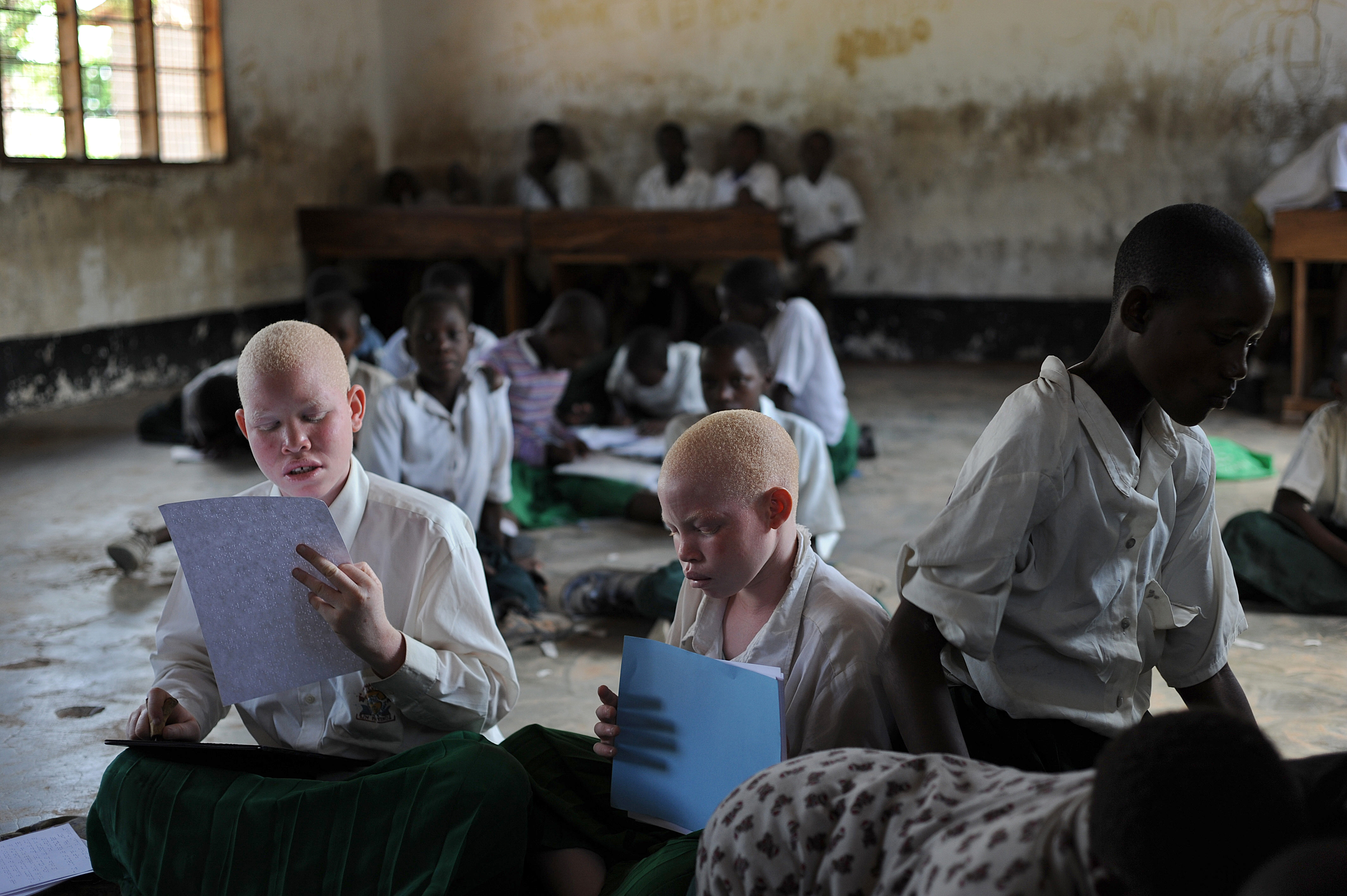 Albino children study on January 28, 2009 at the Mitindo Primary School for the blind,  which has become a rare sanctuary for albino children. (Tony Karumba—AFP/Getty Images)