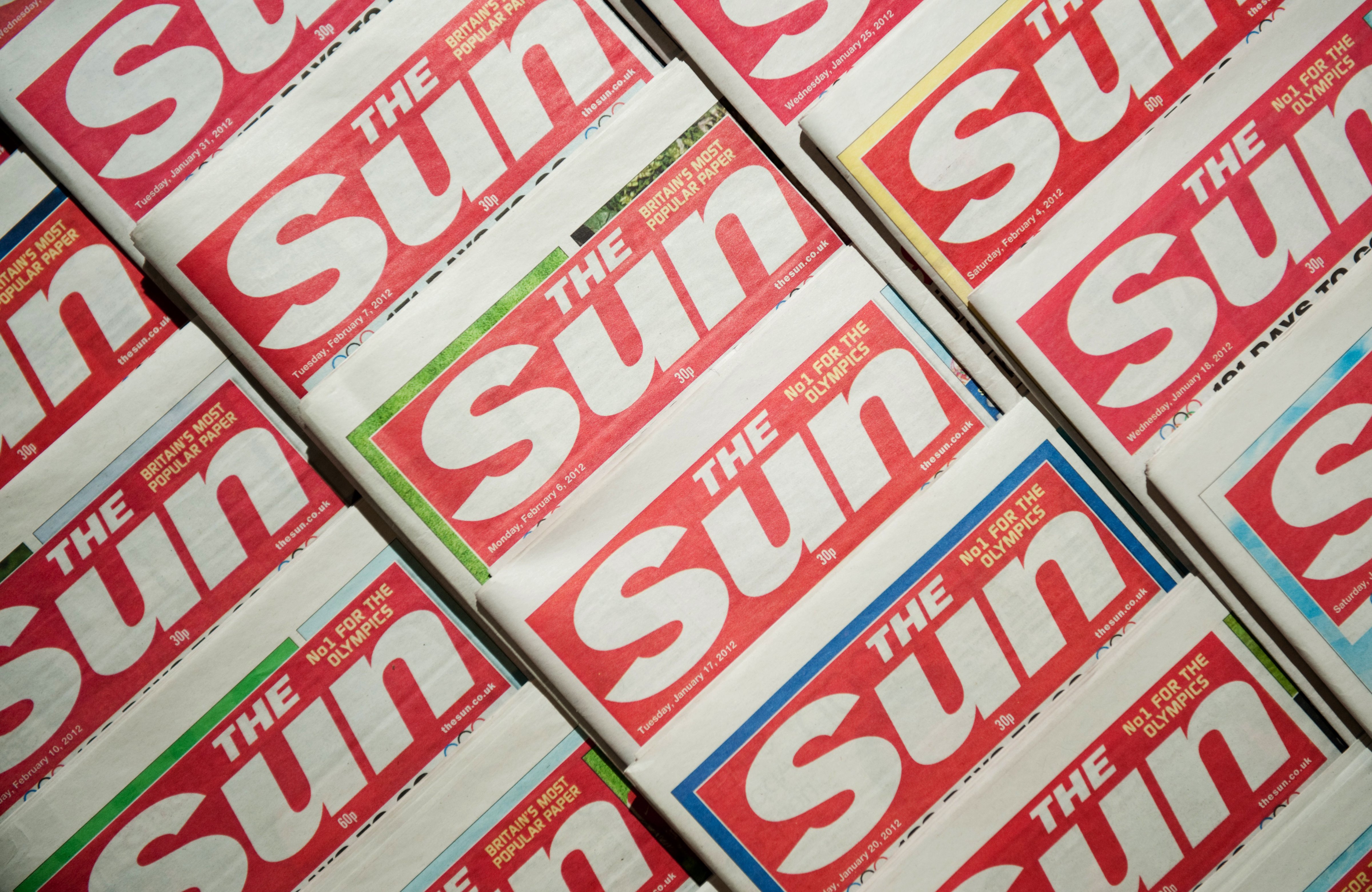 Picture shows an arrangement of copies of The Sun newspaper front pages on February 13, 2012. (LEON NEAL—AFP/Getty Images)