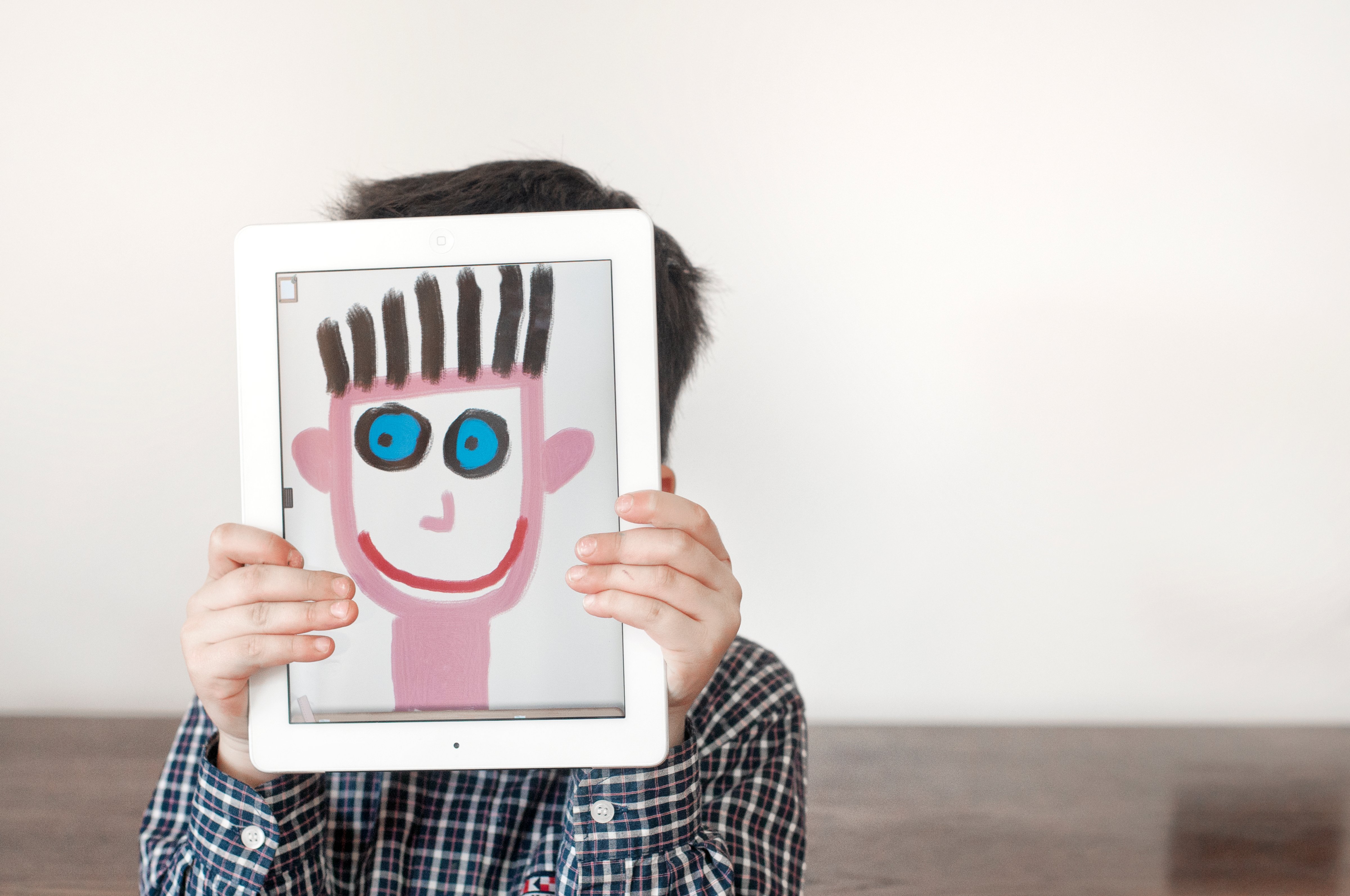Painted face on tablet (Marta Nardini—Getty Images/Flickr RF)