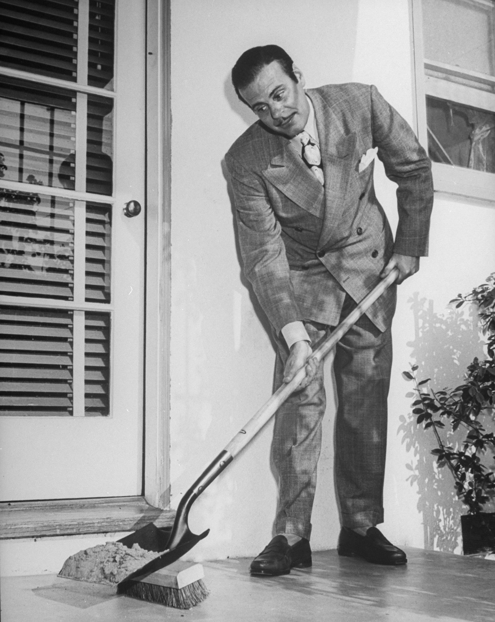 Shovel-brush, used by Comedian Billy de Wolfe, is artfully designed to sweep and scoop in one simple motion.