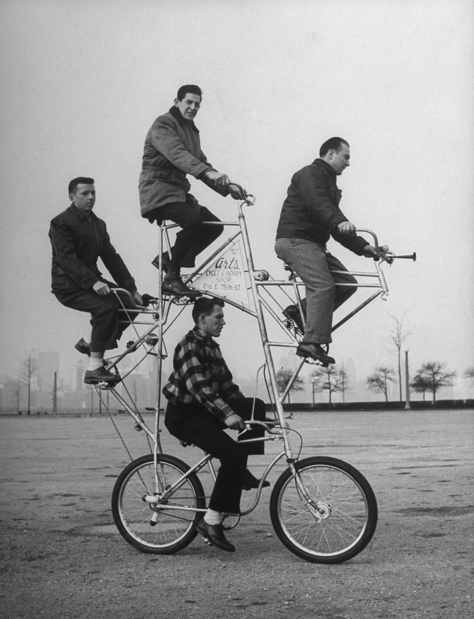 Eccentric four-man bicycle built by Art Rothchild (top position).