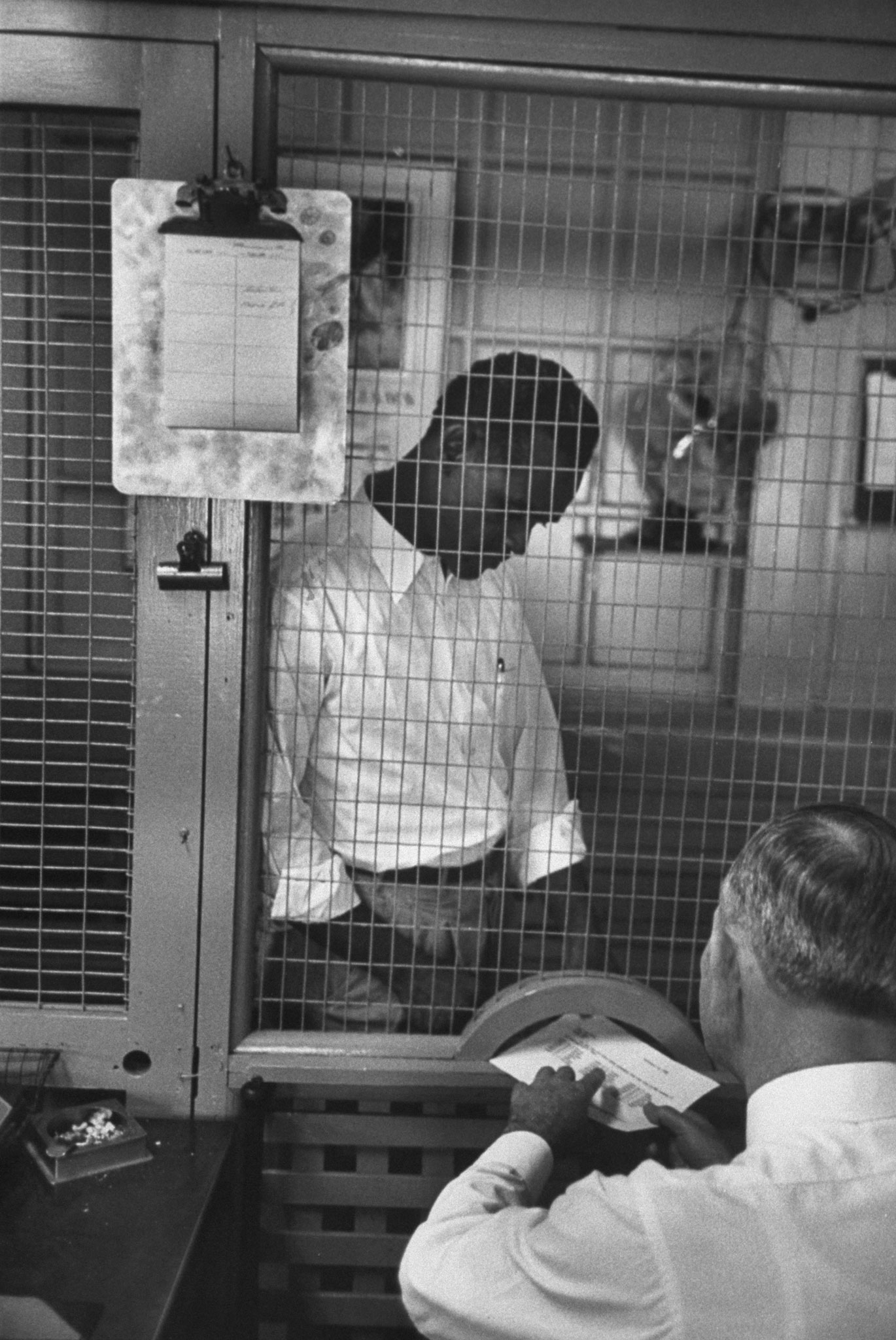 Prisonaire William Stewart and night warden, Tennessee State Penitentiary, 1953.