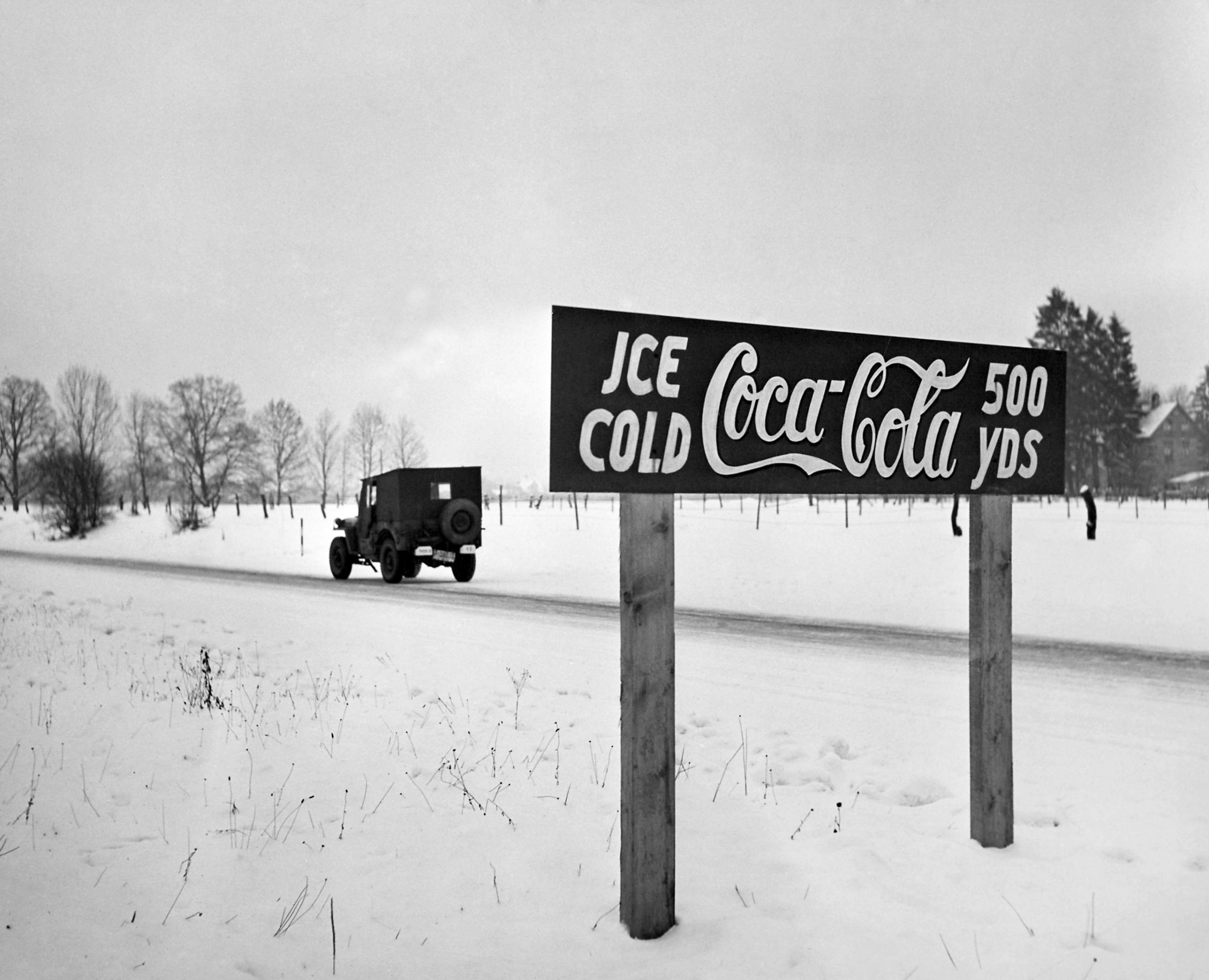 A Coca-Cola road sign beckons on the Autobahn between Munich and Salzberg, Germany, 1947.