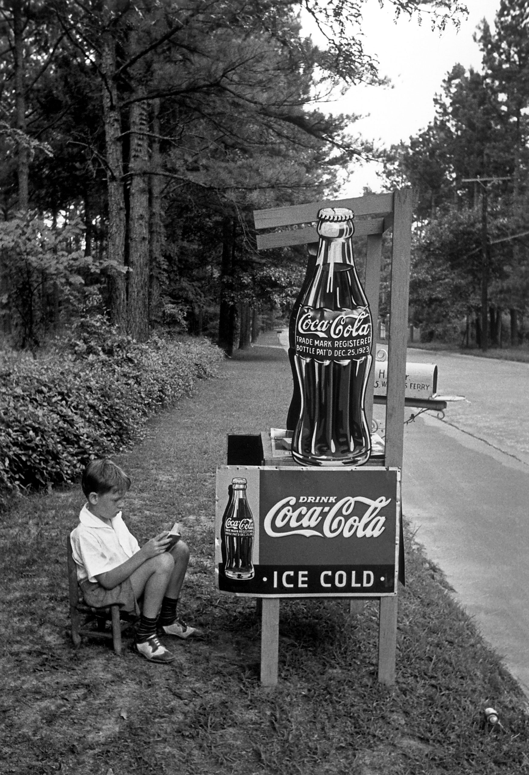Boy selling Coca Cola from roadside stand., 1936
