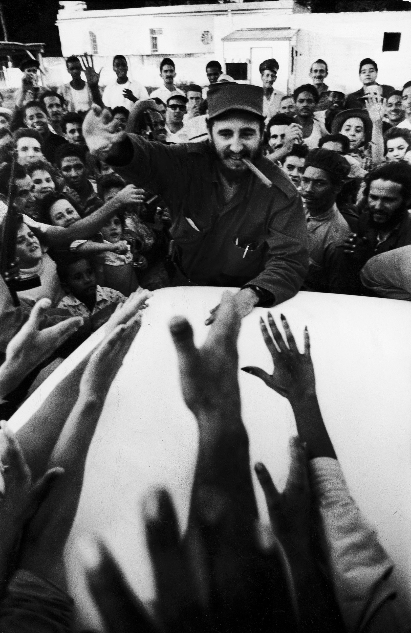 Fidel Castro cheered by crowds on victorious march to Havana after ousting Cuban dictator Fulgencio Batista, 1959.