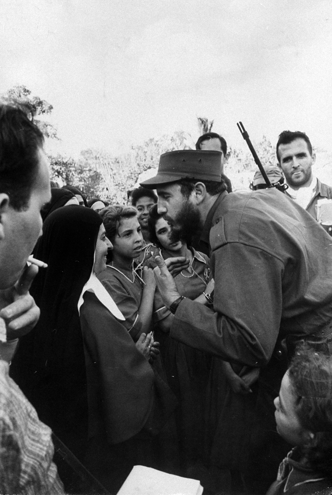 Fidel Castro talking to a nun during his victorious march to Havana, 1959.