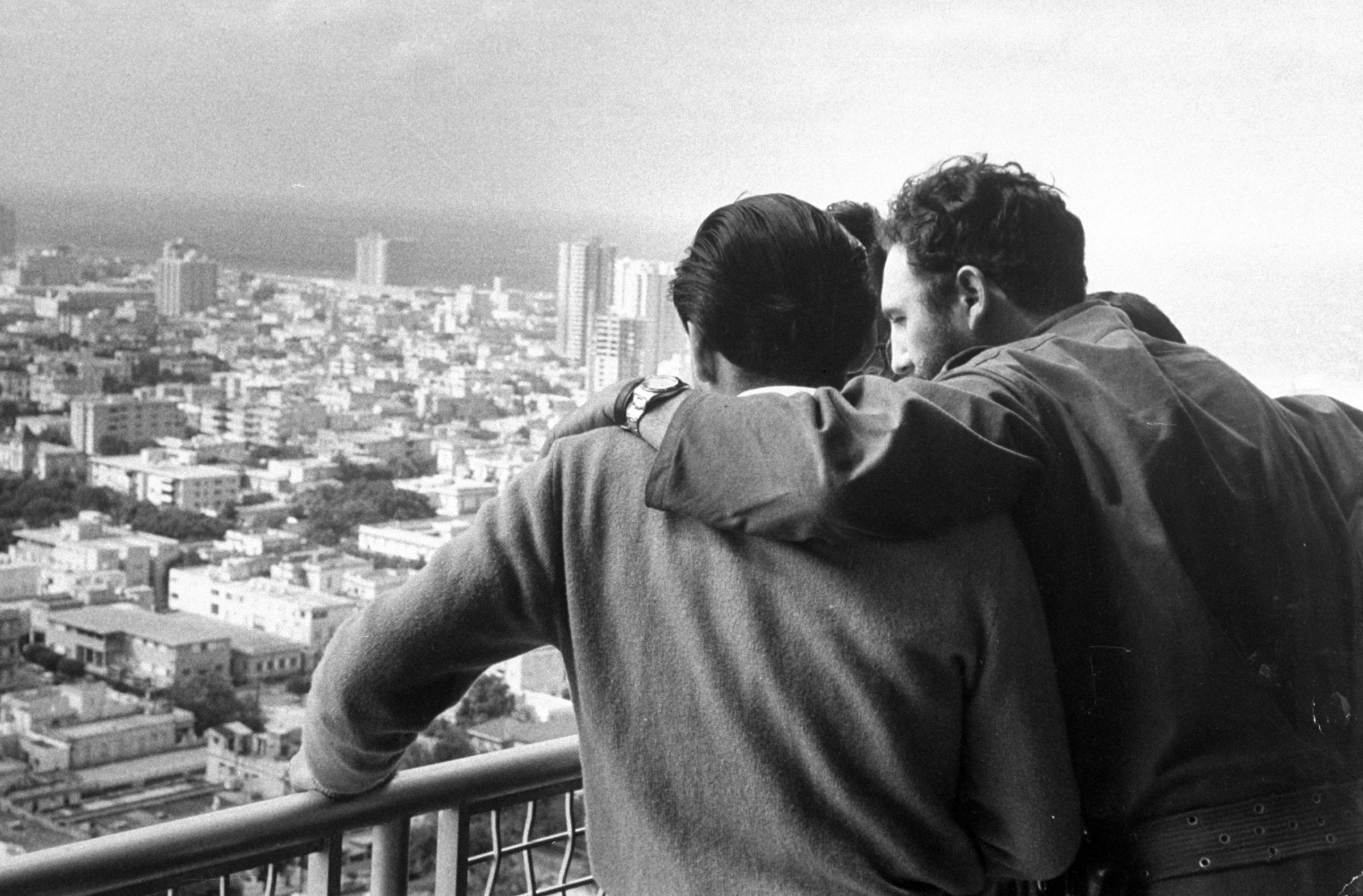Fidel Castro with friends on a balcony of the Havana Hilton Hotel after his triumphal entry into the city, 1959.