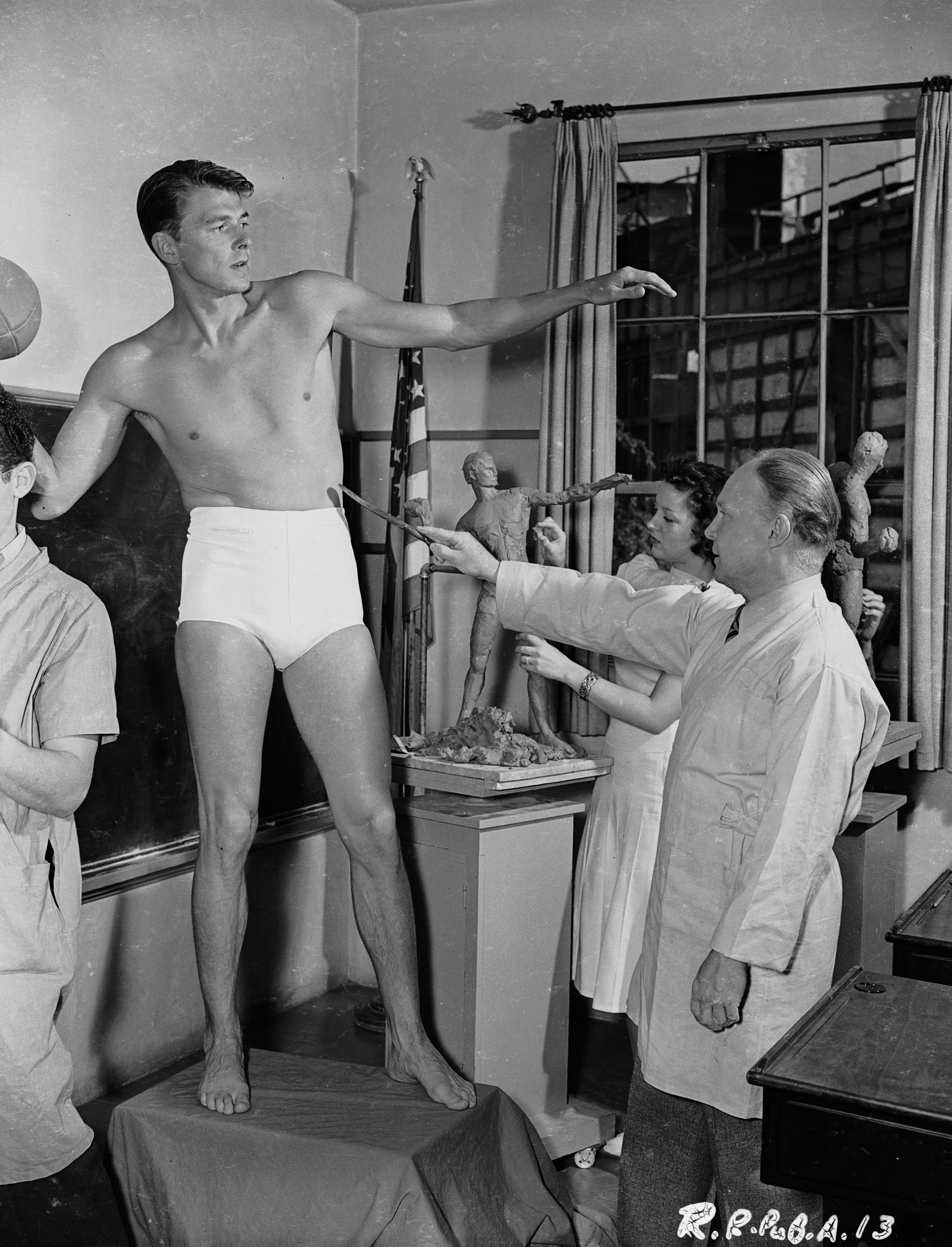 American leading man and future US President, Ronald Reagan modelling for a sculpture, circa 1939.