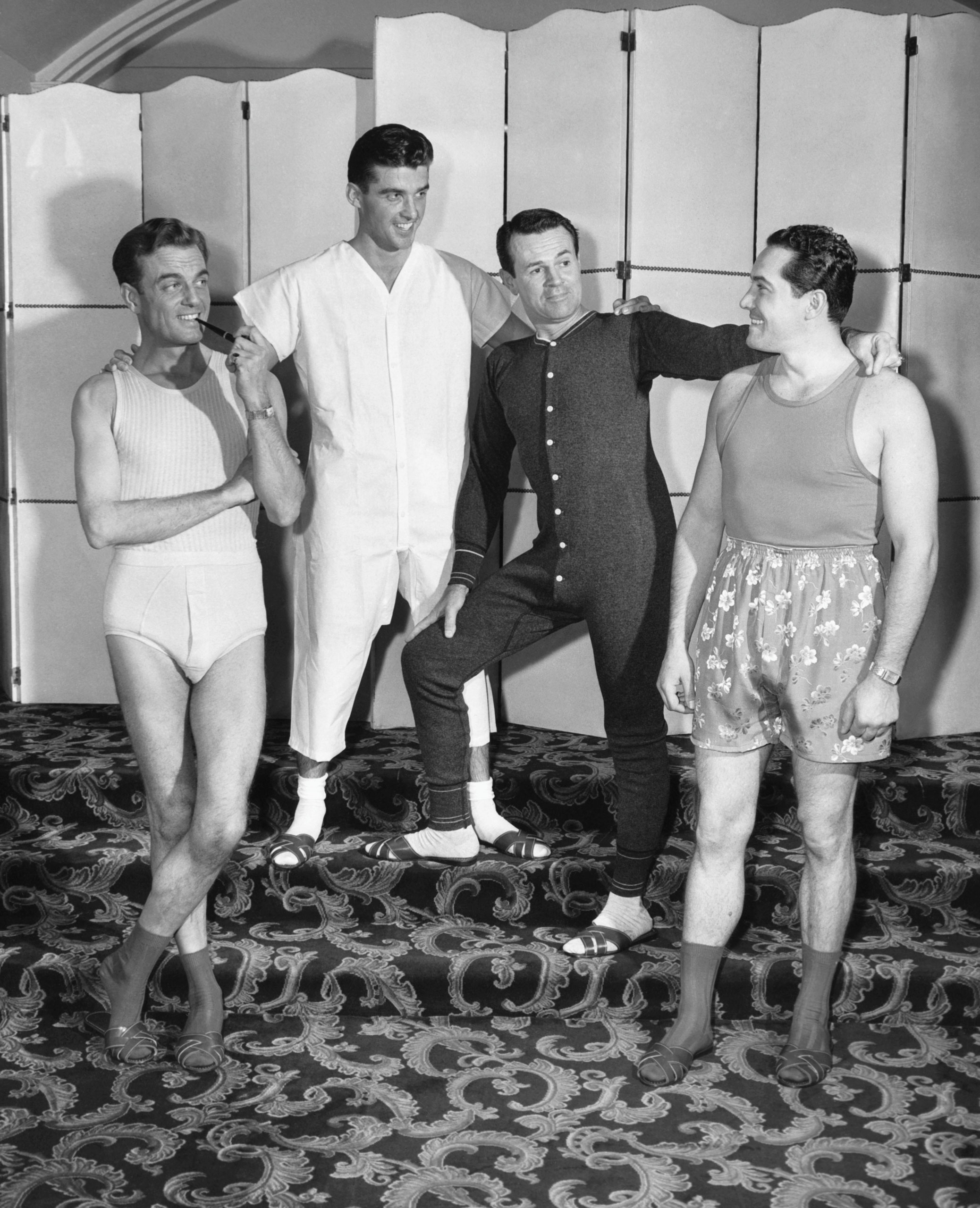 Four men dressed in underwear, 1948.