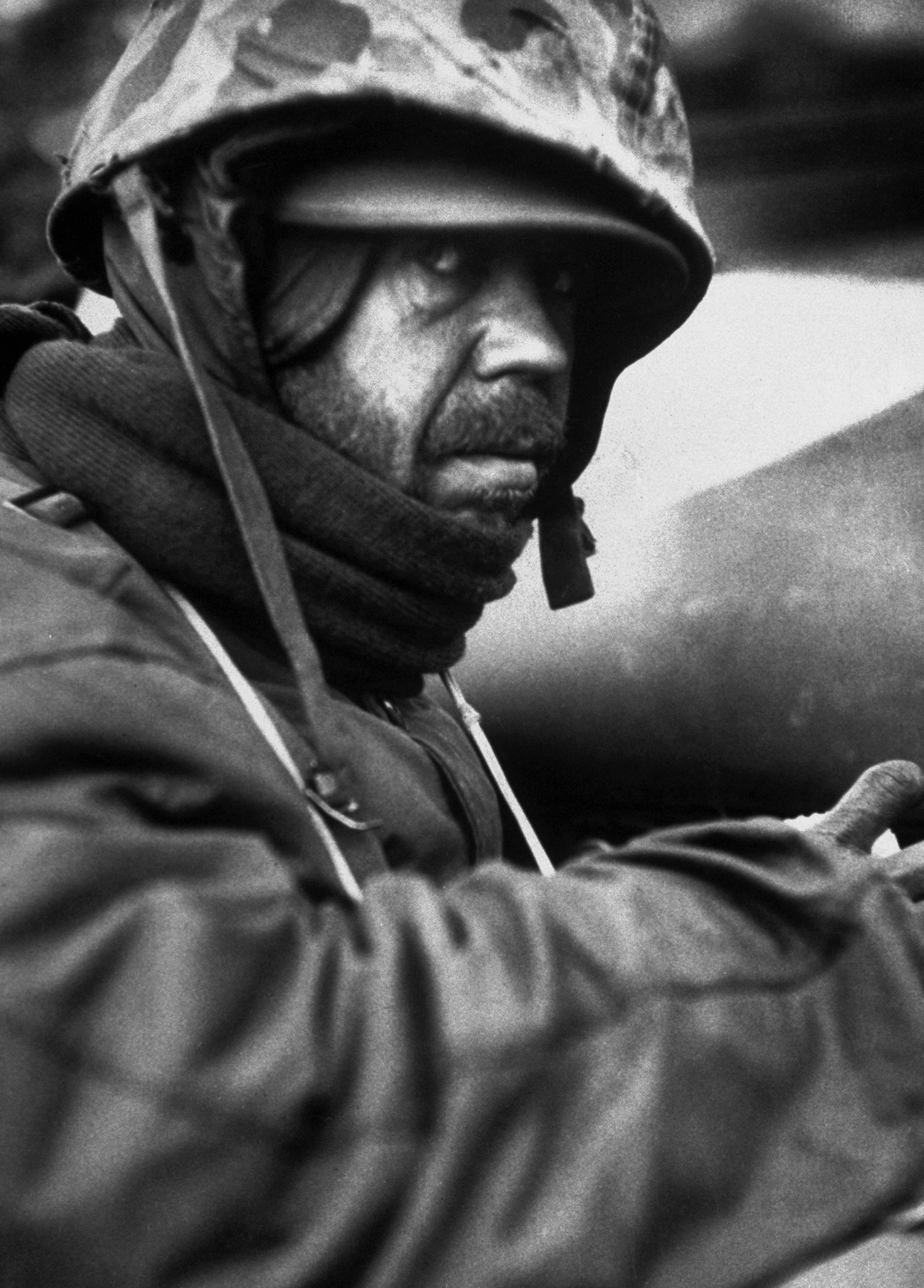 A weary American Marine hooded against the cold during the grim retreat from Chosin Reservoir, Korea, winter 1950.
