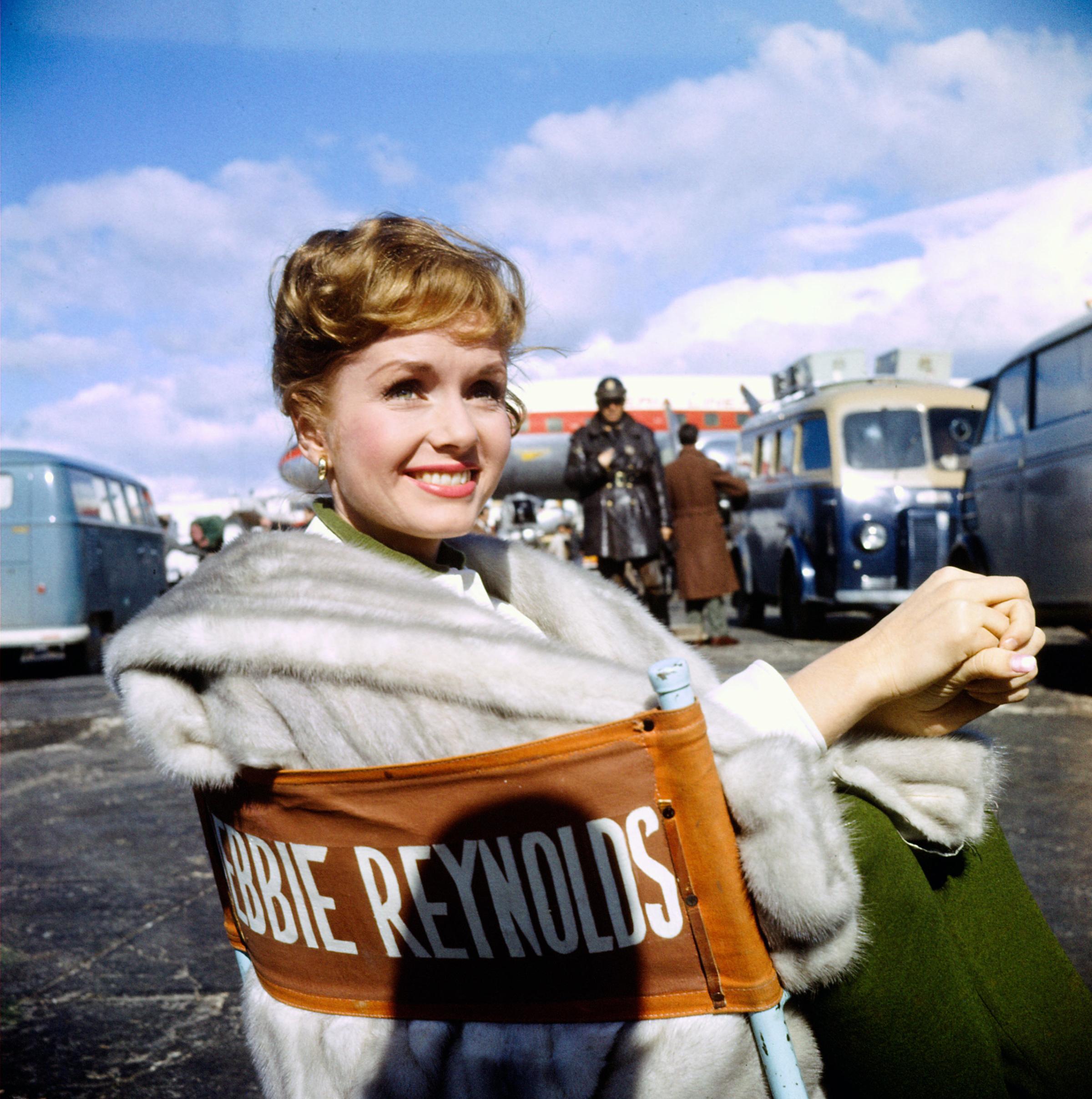 Debbie Reynolds at an airport during filming of "It Started With a Kiss."