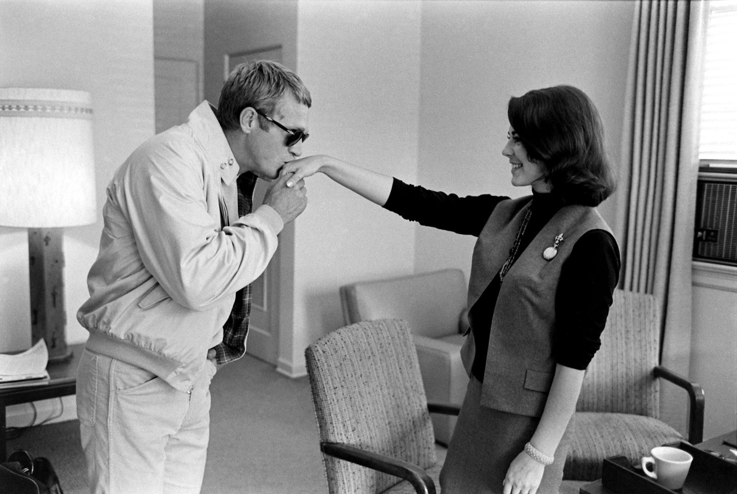 Steve McQueen kisses Natalie Wood's hand in 1963.