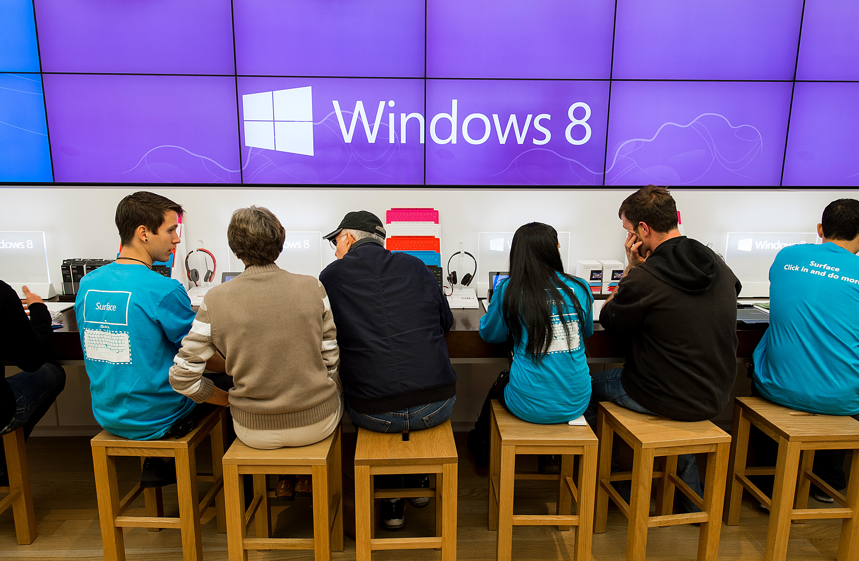 Employees assist customers at the opening of a Microsoft Corp. store in Bellevue, Washington, U.S., on Friday, Oct. 26, 2012. (Bloomberg&mdash;Bloomberg via Getty Images)