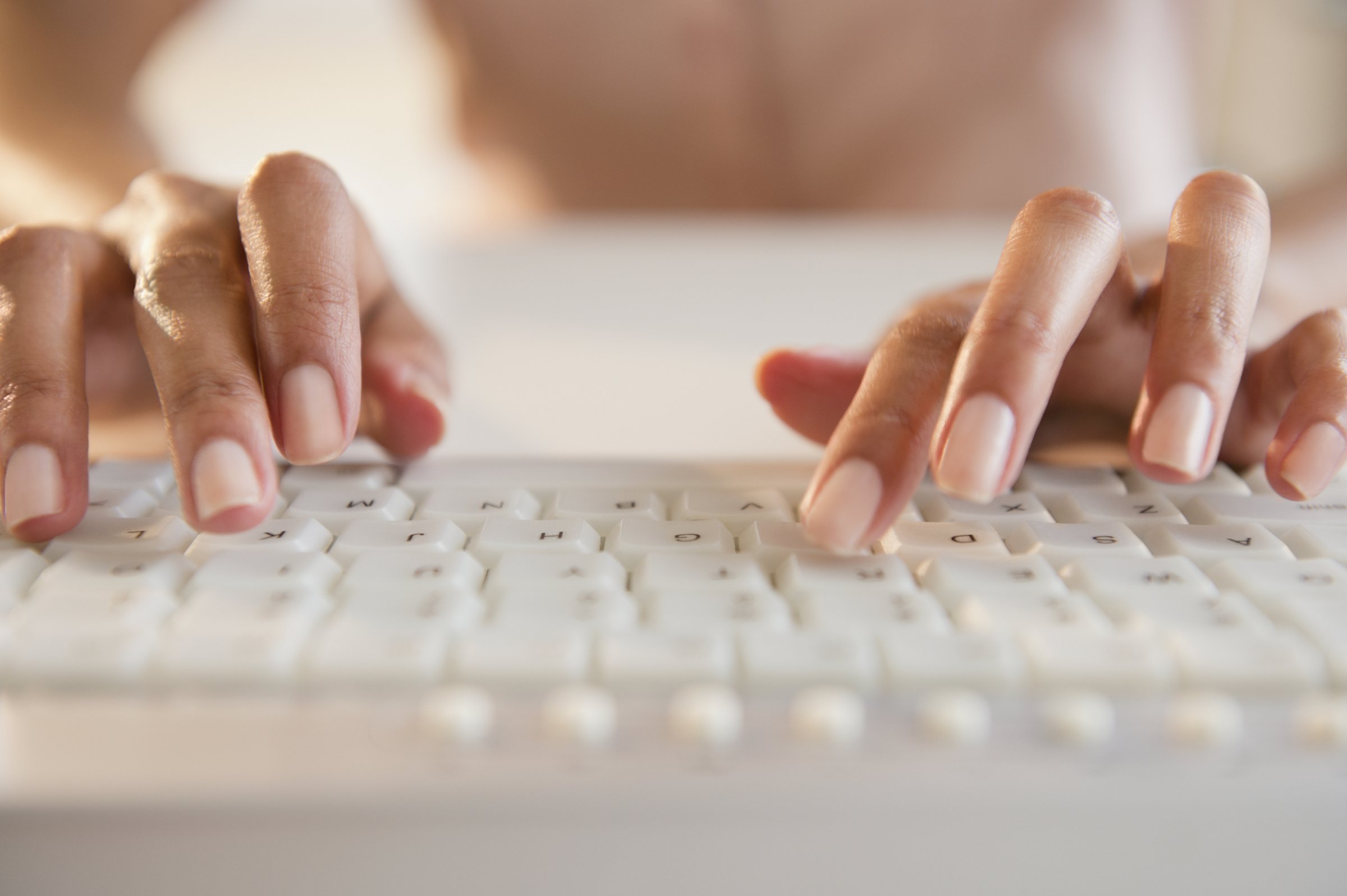 woman-typing-computer-keyboard
