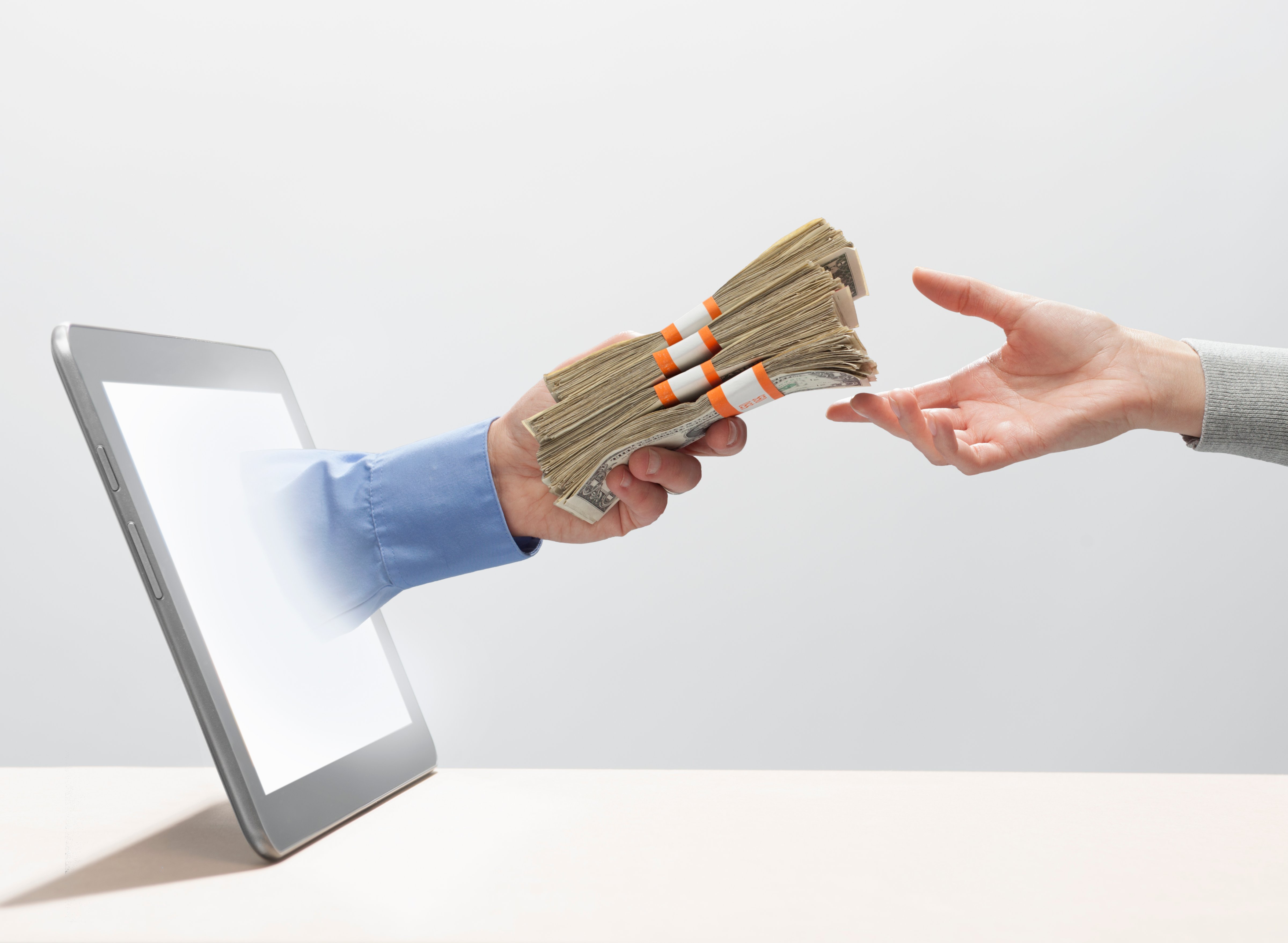 Exchanging money digitally (PM Images&mdash;Getty Images)