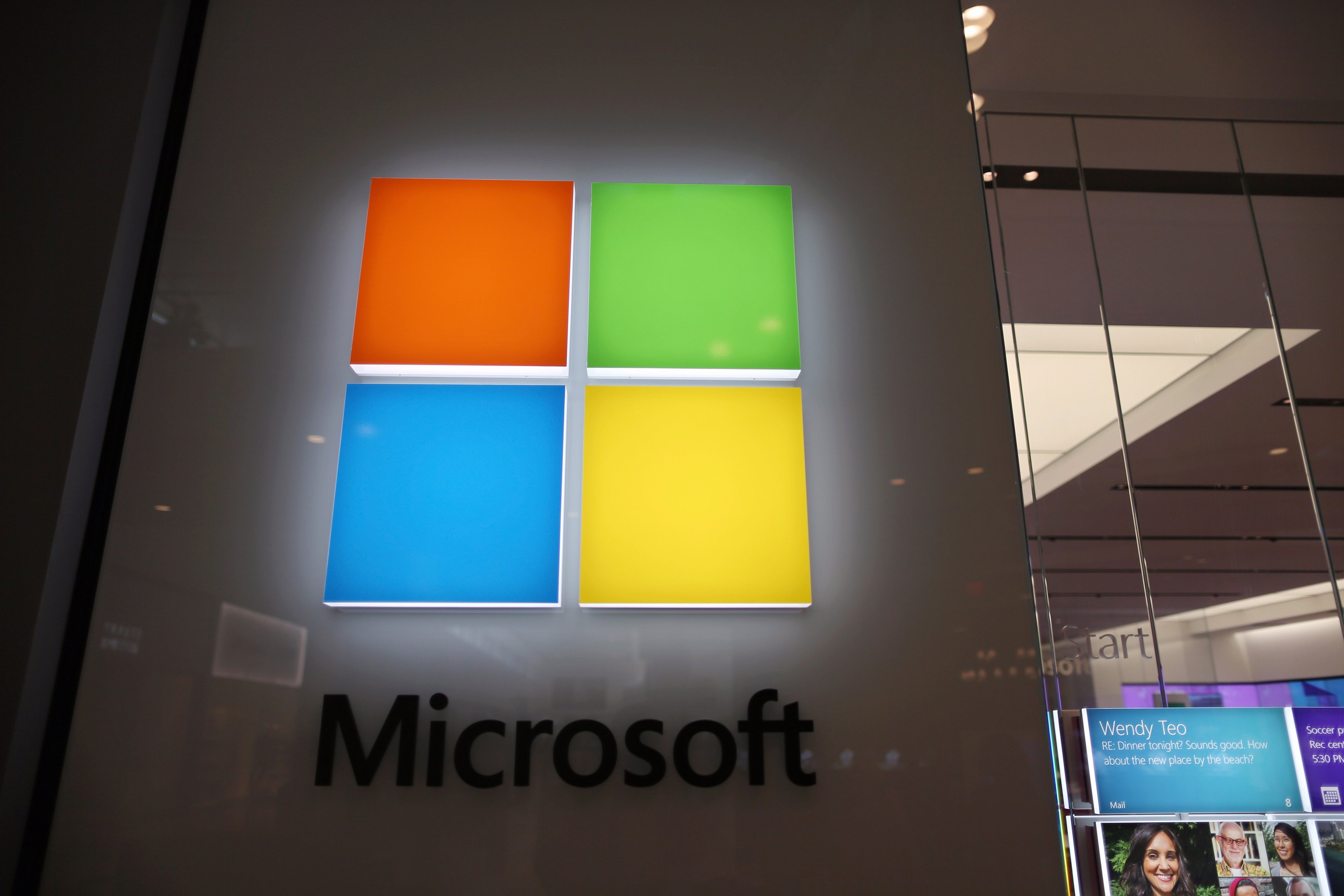 A sign is seen on the wall outside of a Microsoft store in the Dadeland Mall. (Joe Raedle&mdash;Getty Images)