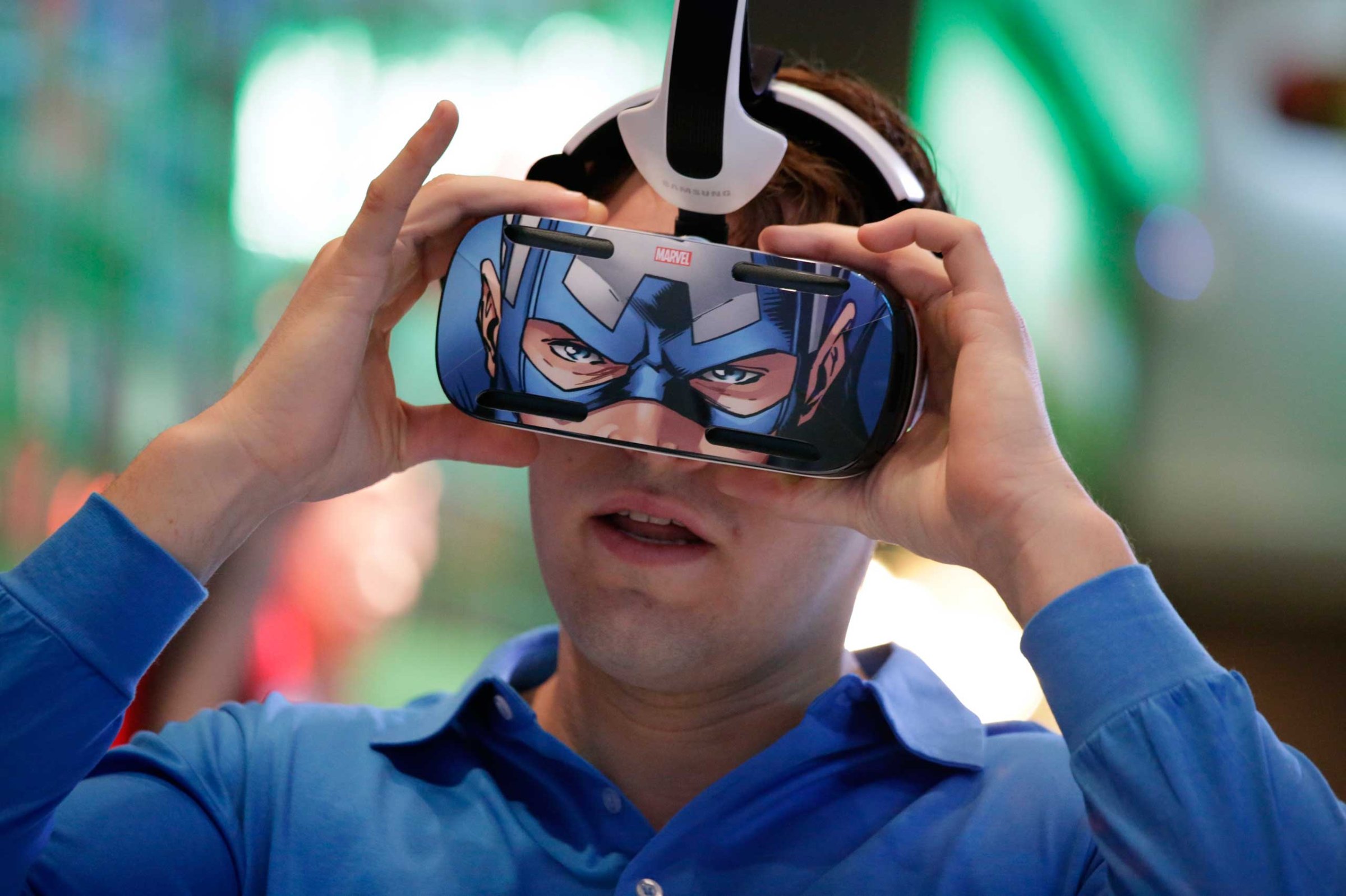 A brand ambassador tests Samsung's Gear VR headset at the Samsung Galaxy booth at the International CES on Jan. 6, 2015, in Las Vegas.