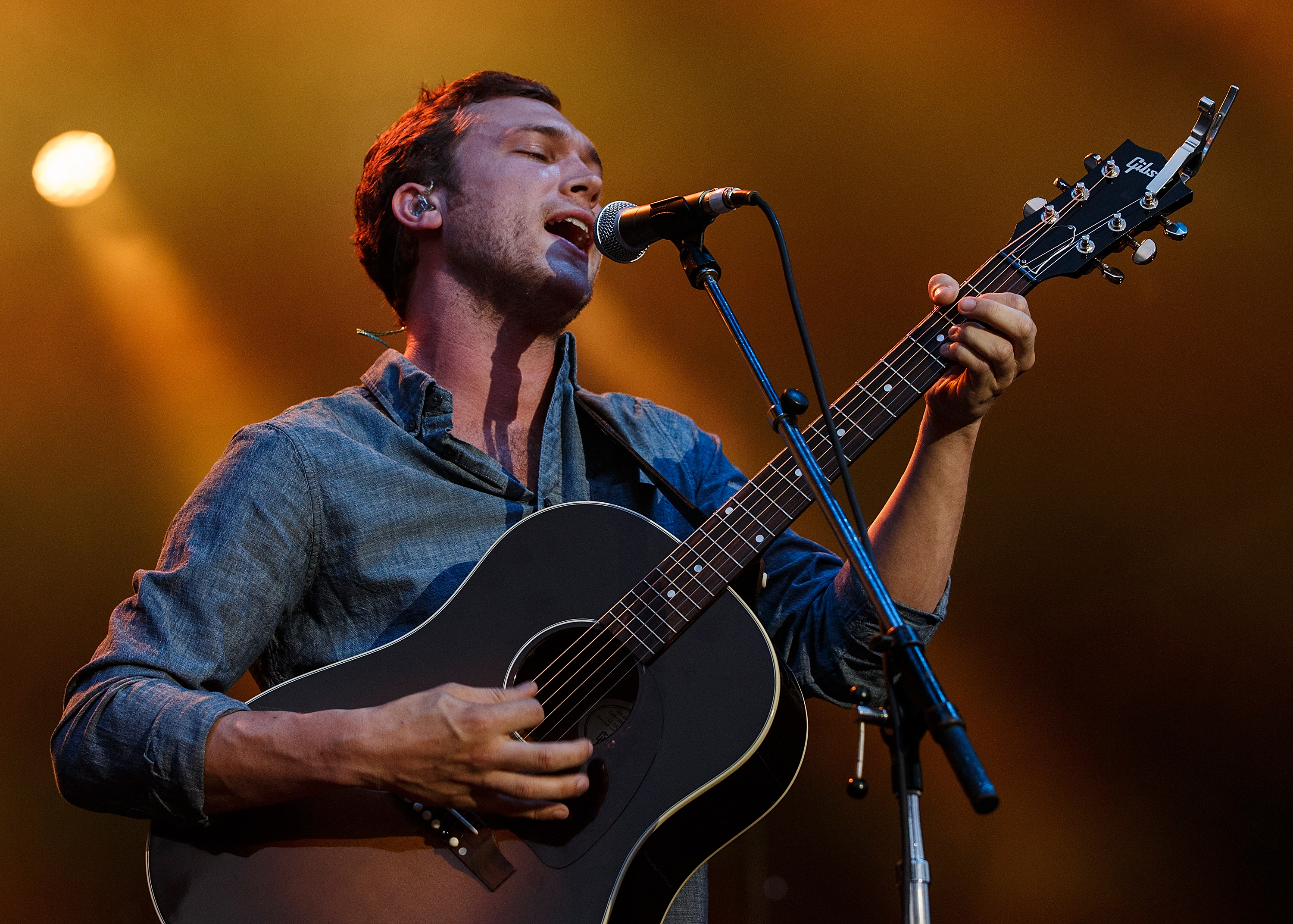 Phillip Phillips performs on stage at PNE Amphitheatre during Day 1 of The Fair At The PNE on August 16, 2014 in Vancouver, Canada. (Andrew Chin—Getty Images)
