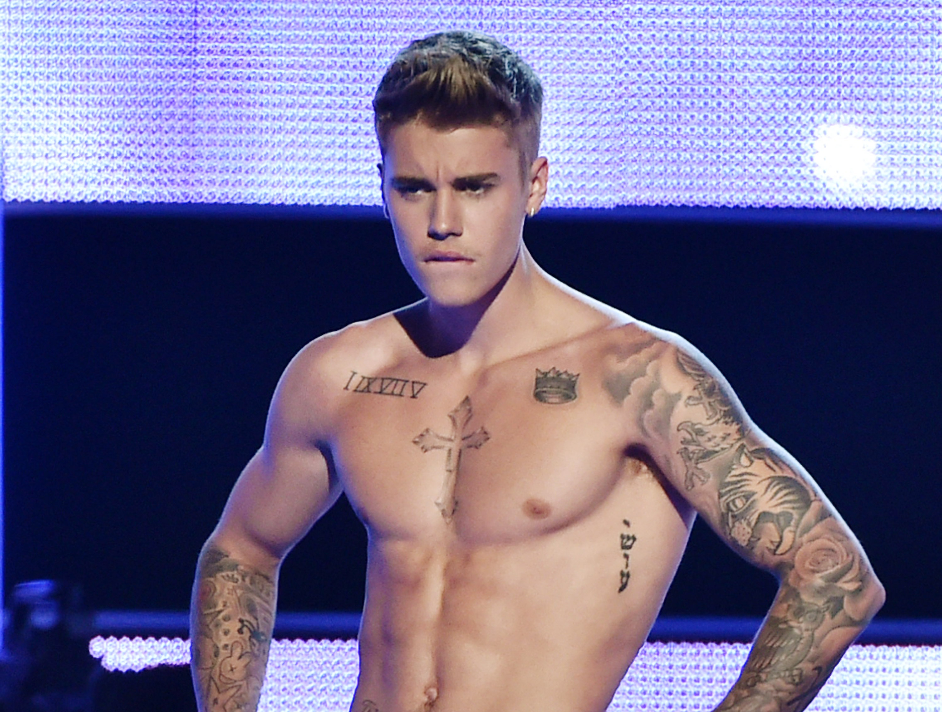 Singer-songwriter Justin Bieber presents onstage at Fashion Rocks 2014 (Theo Wargo&mdash;2014 Getty Images)