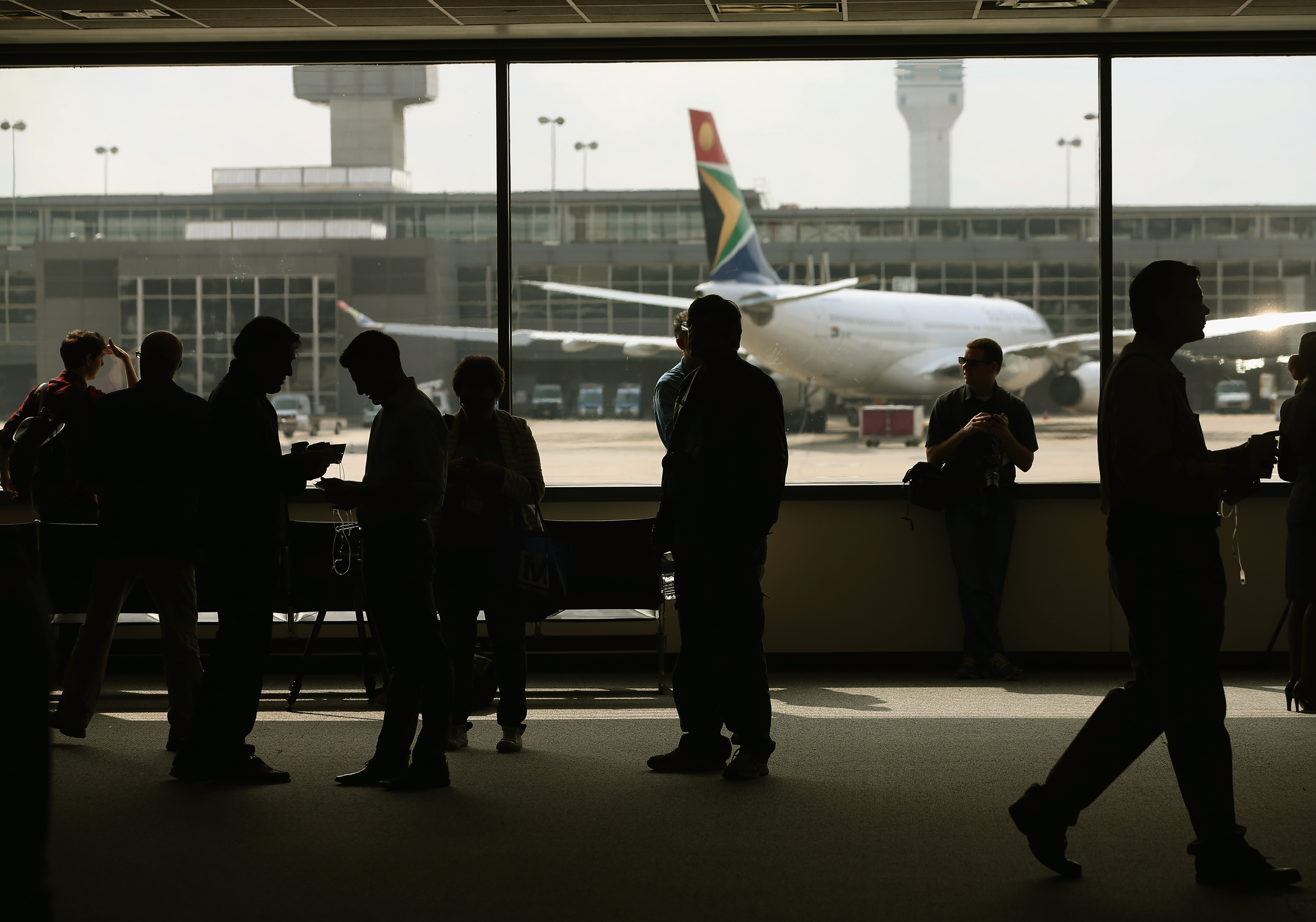 People stand in the main terminal at Washington Dulles International Airport is shown October 2, 2014 in Dulles, Virginia. (Mark Wilson&mdash;Getty Images)