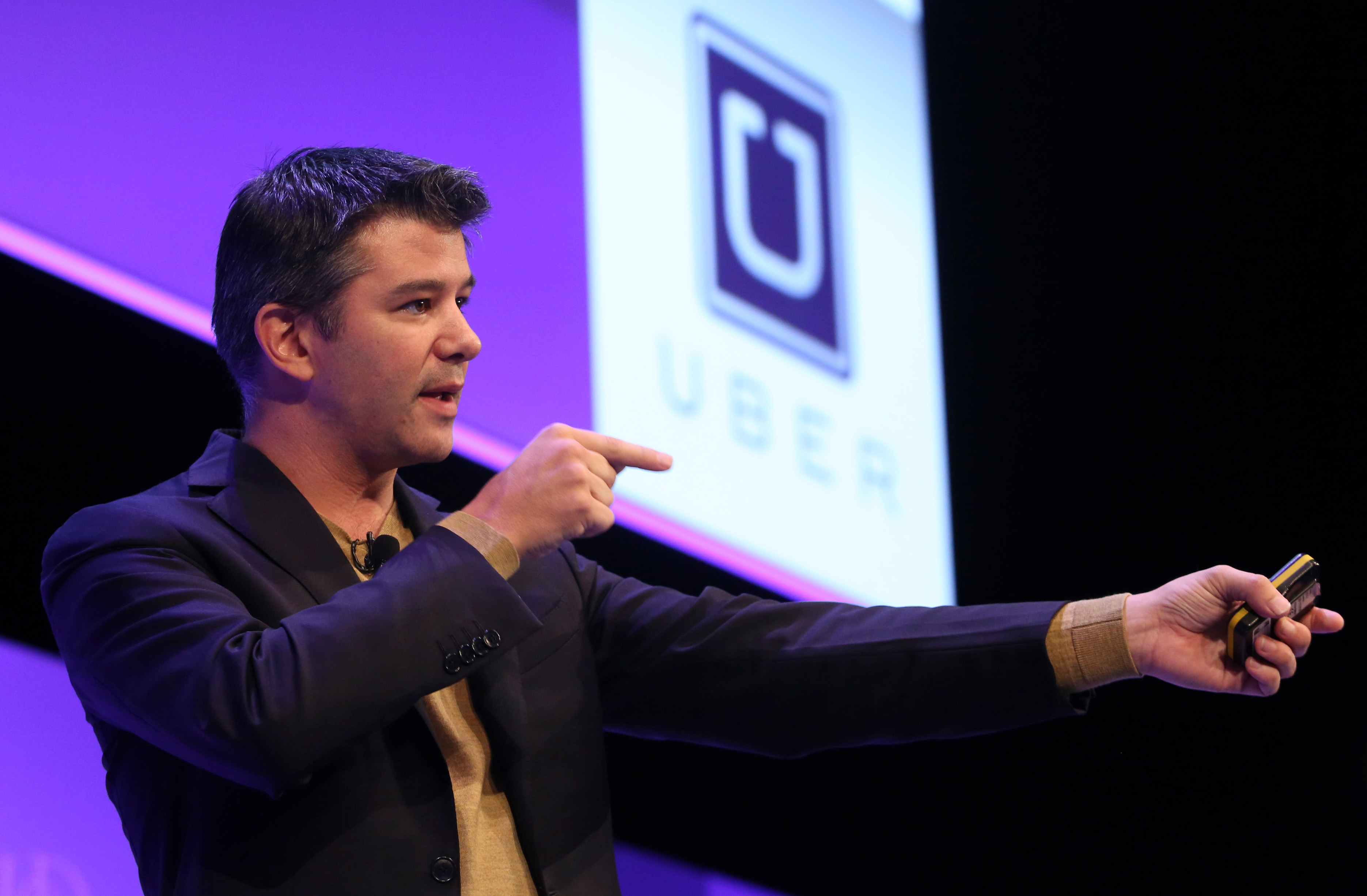 Travis Kalanick, chief executive officer of Uber Technologies Inc., gestures as he speaks during the Institute of Directors (IOD) annual convention at the Royal Albert Hall in London, U.K., on Oct. 3, 2014.