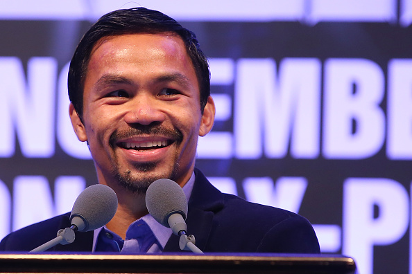 Manny Pacquiao speaks to media at the postfight press conference after winning against Chris Algieri during the WBO world welterweight title at The Venetian in Macau on Nov. 23, 2014 (Chris Hyde—Getty Images)