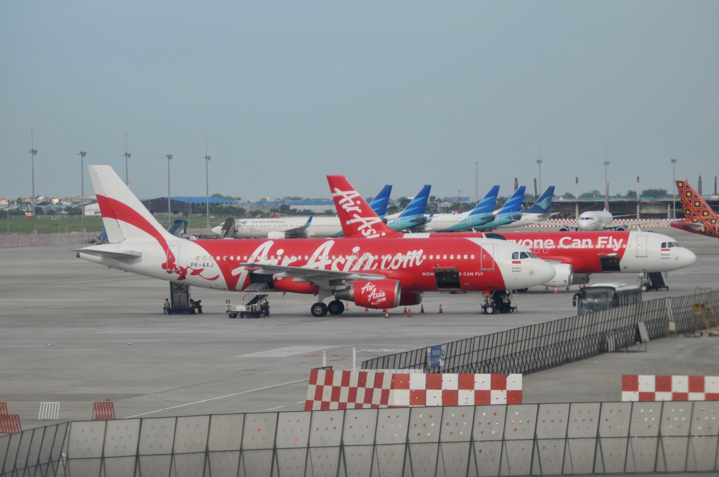 JAKARTA, INDONESIA - DECEMBER 29 : AirAsia aircrafts on the strip at Soekarno Hatta International Airport near Jakarta, on December 29, 2014. Malaysia, Singapore and Australia  have deployed planes and ships to assist in the Indonesian search for the missing AirAsia flight near Borneo while flying from Surabaya to Singapore with 162 passengers on board.   (Photo by Agoes Rudianto/Anadolu Agency/Getty Images)