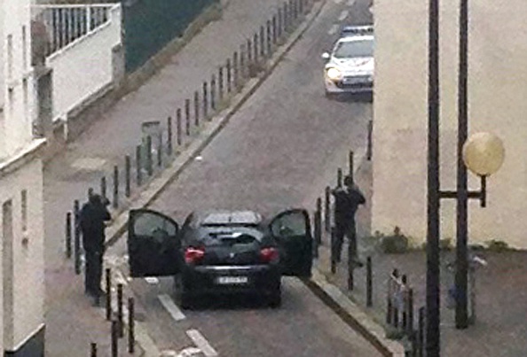The Kouachi brothers face police after their killing spree inside the offices of Charlie Hebdo Jan. 7. (Anne Gelbard—AFP/Getty Images)