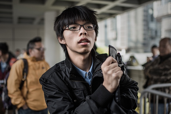 Hong Kong student activist Joshua Wong is pictured outside the High Court in Hong Kong on Jan. 8, 2015 (Philippe Lopez—AFP/Getty Images)